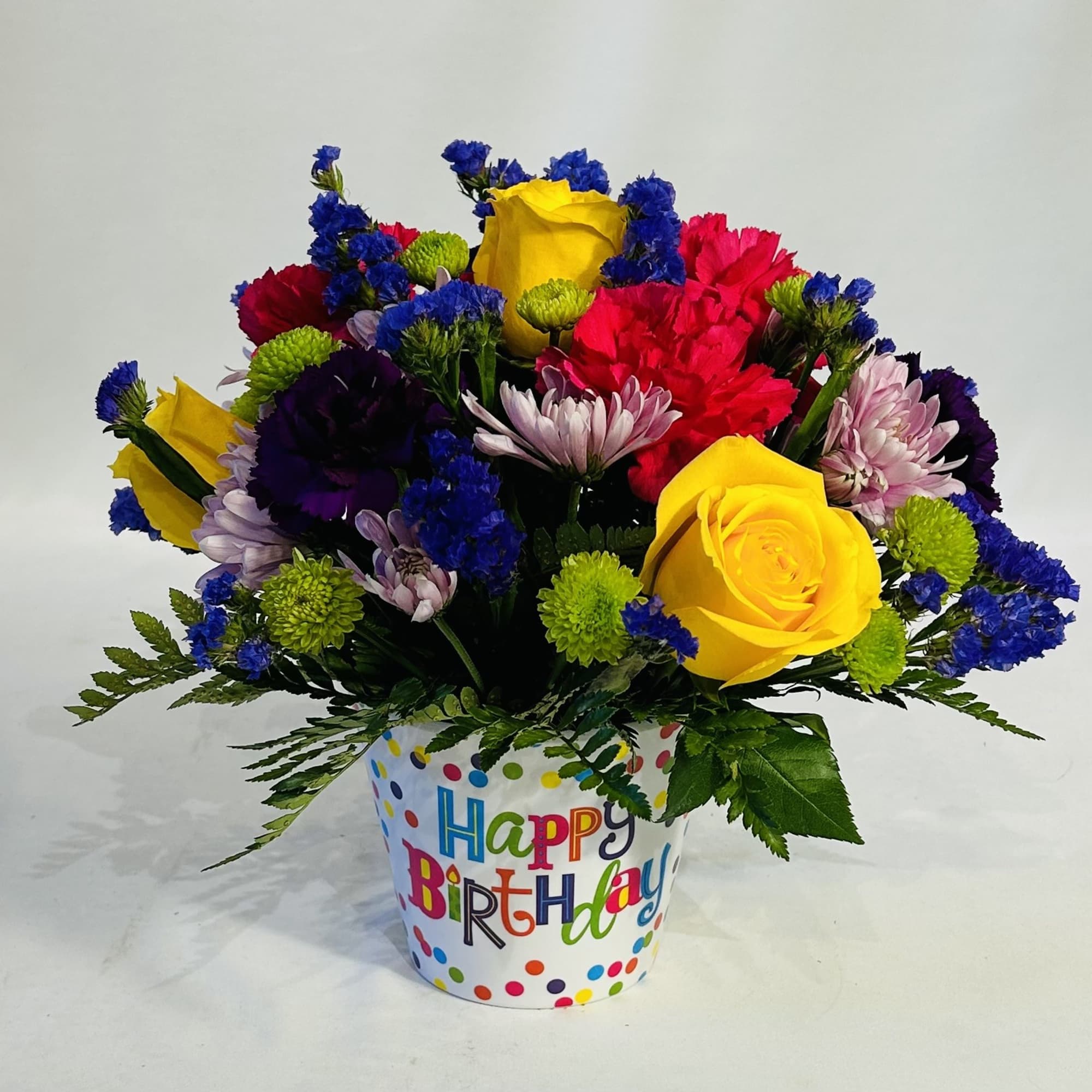 Colorful mixed flower bouquet in a birthday pot