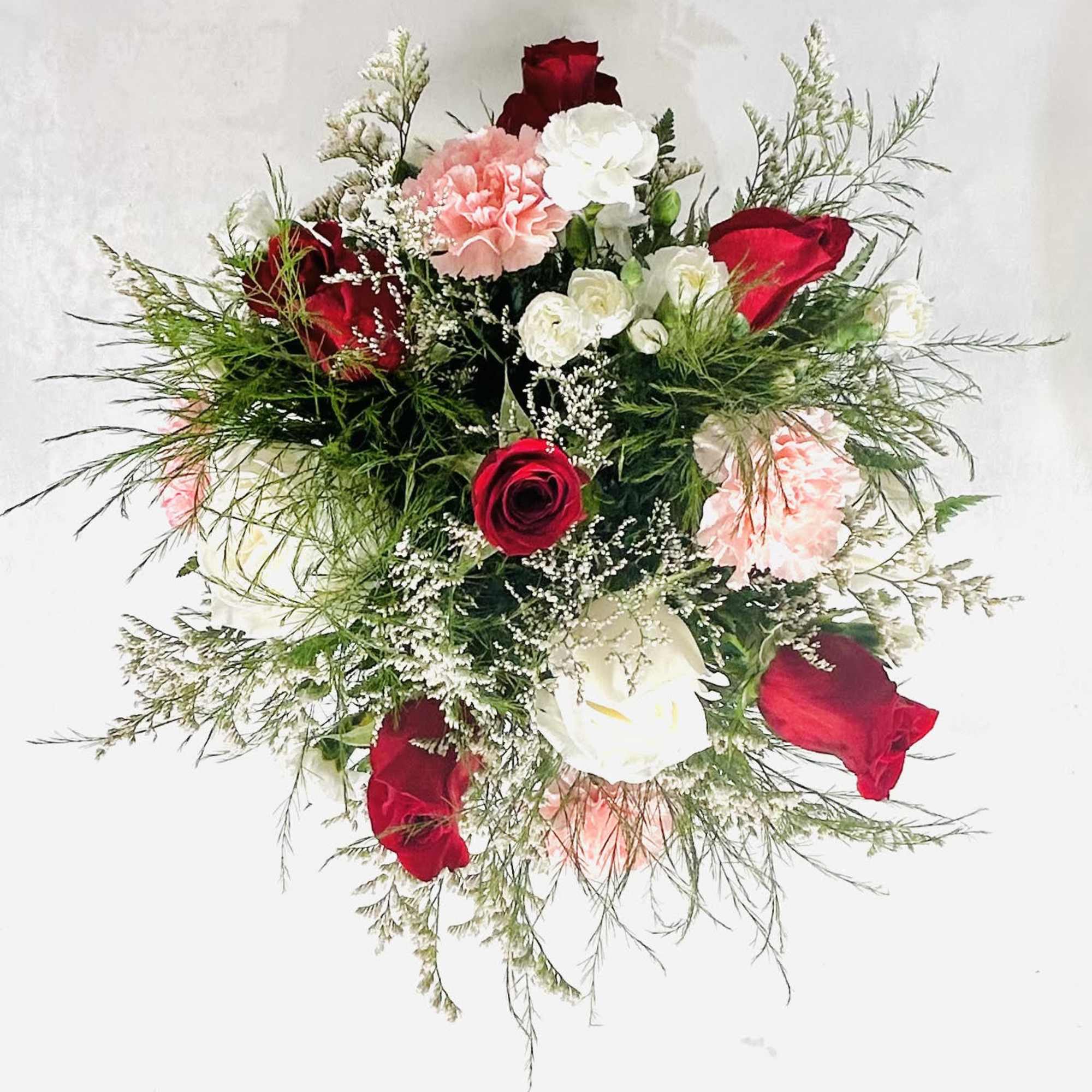 Bouquet of red and white roses with pink carnations