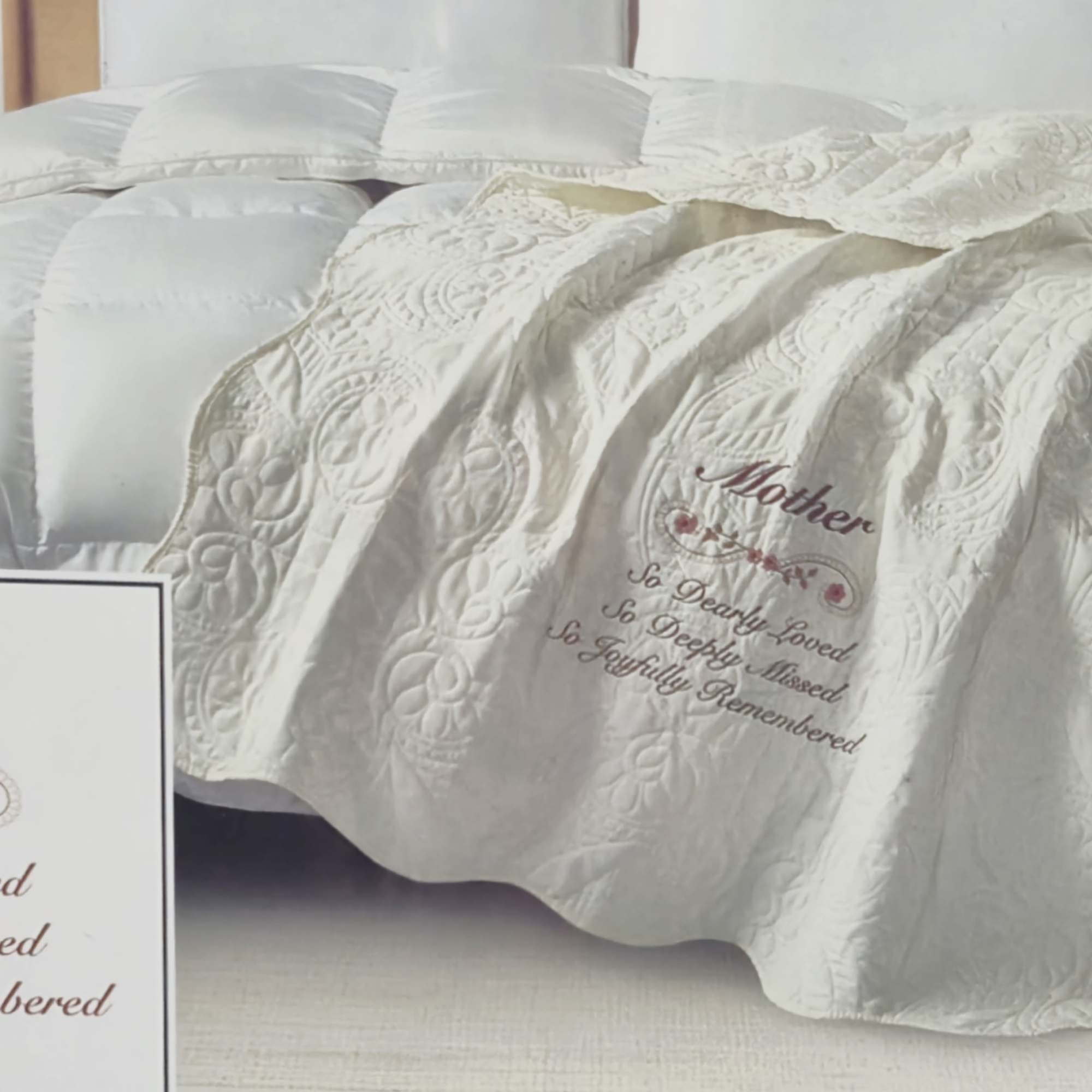 Soft, embroidered comfort designed to honor a mother's memory-this sympathy quilted throw
