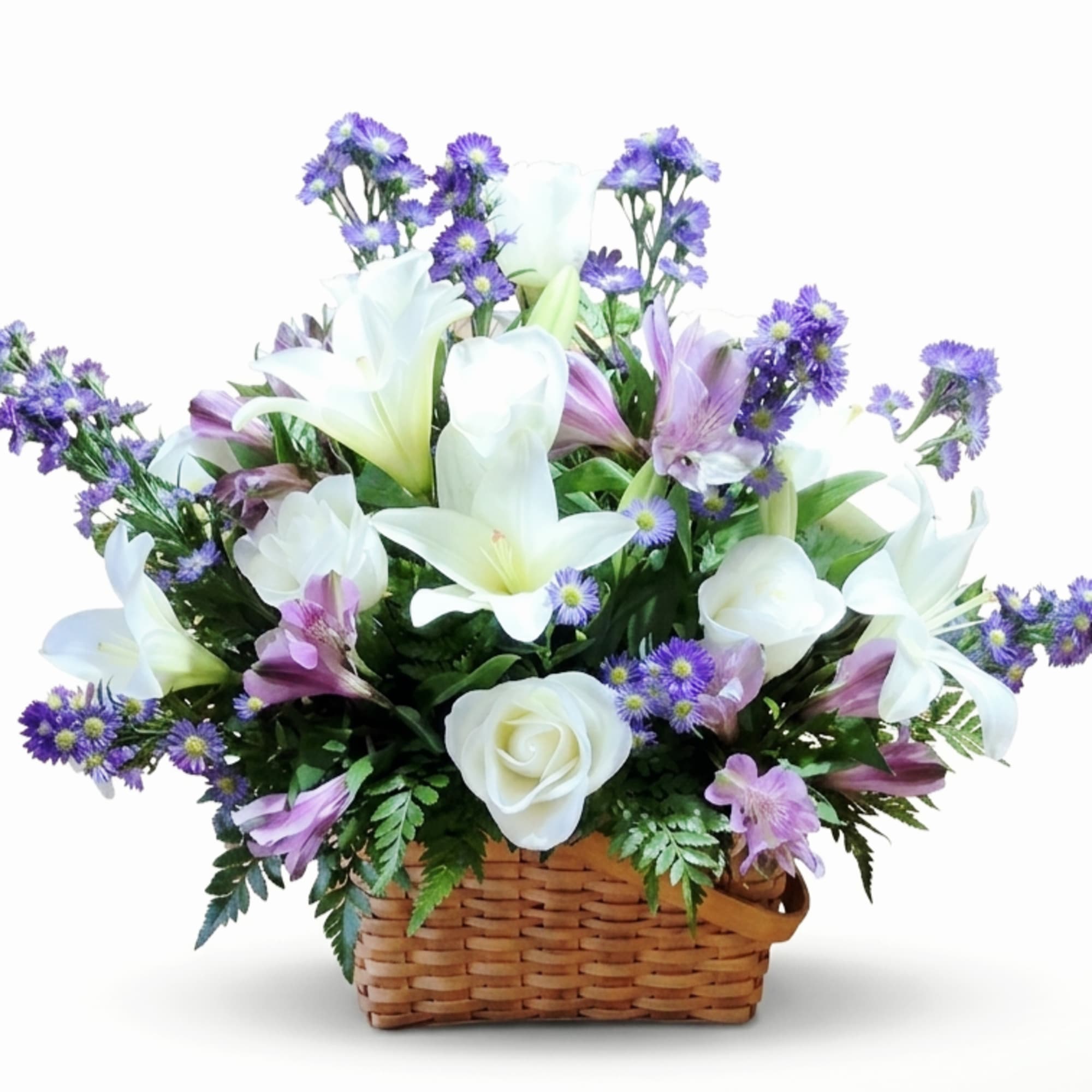 White lilies and white roses take center stage in this airy basket