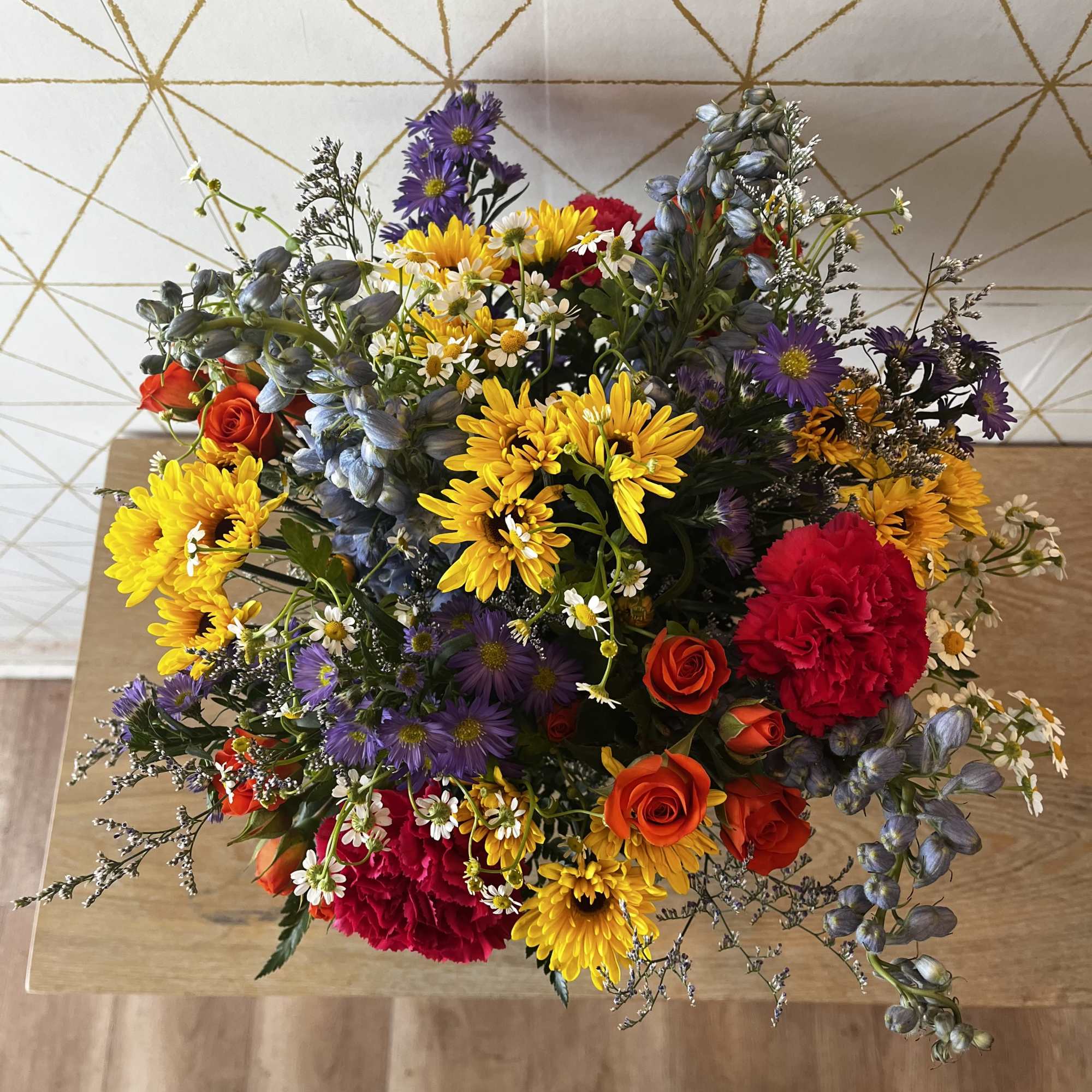 Mixed bouquet with yellow, purple, red, and pink flowers