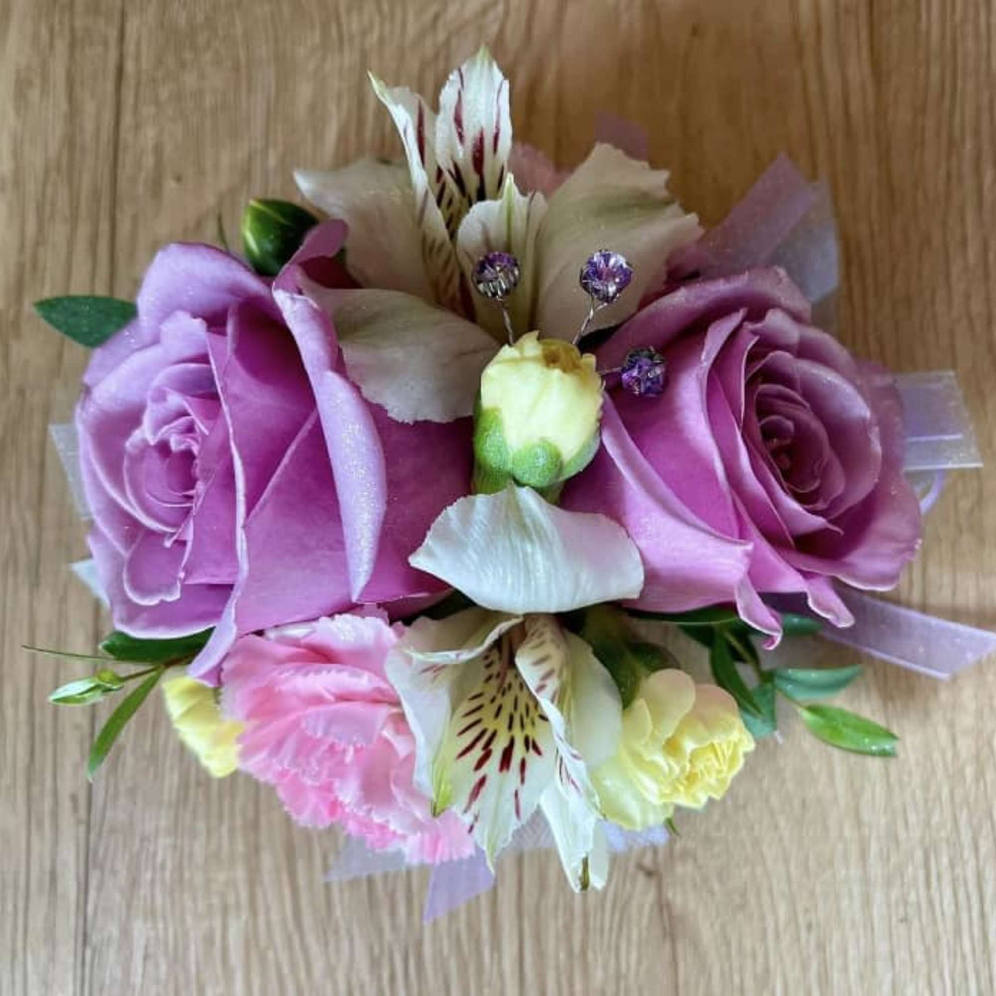 Small bouquet of pink roses, alstroemeria, and carnations