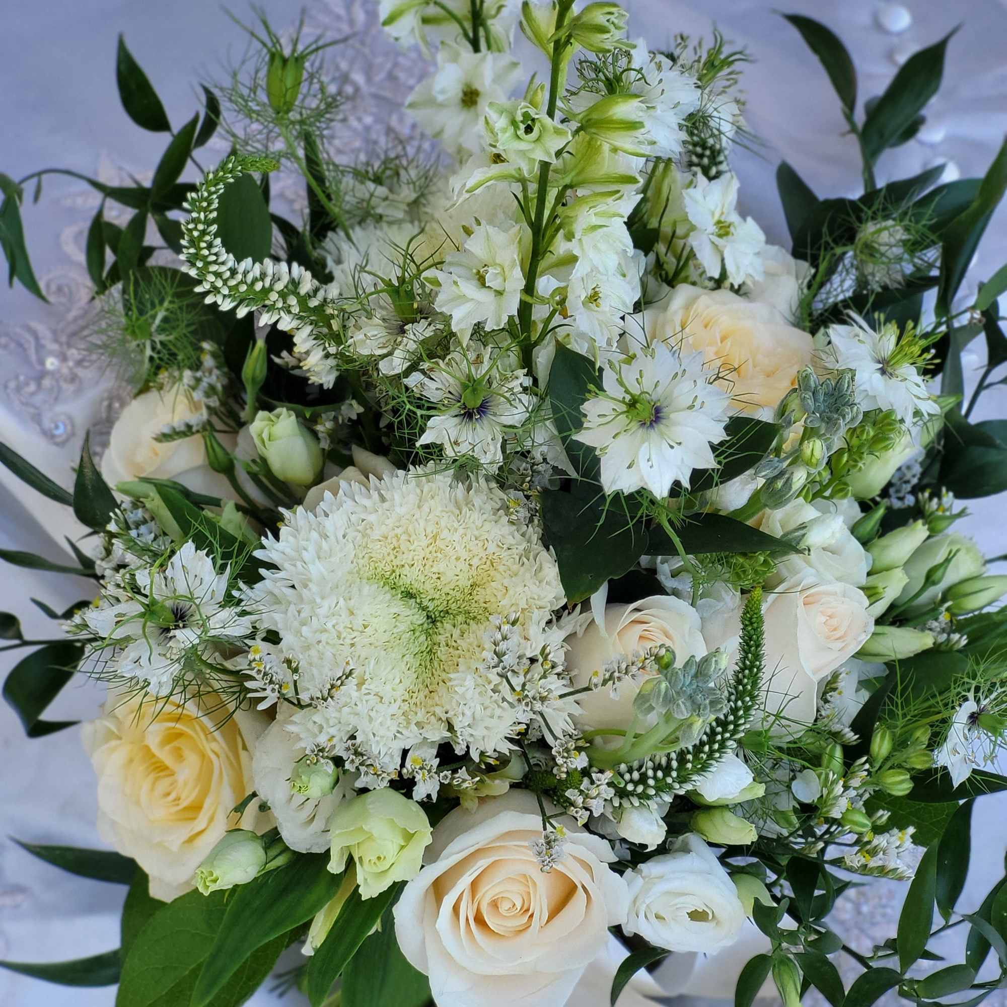 White and cream bouquet with roses and mixed blooms