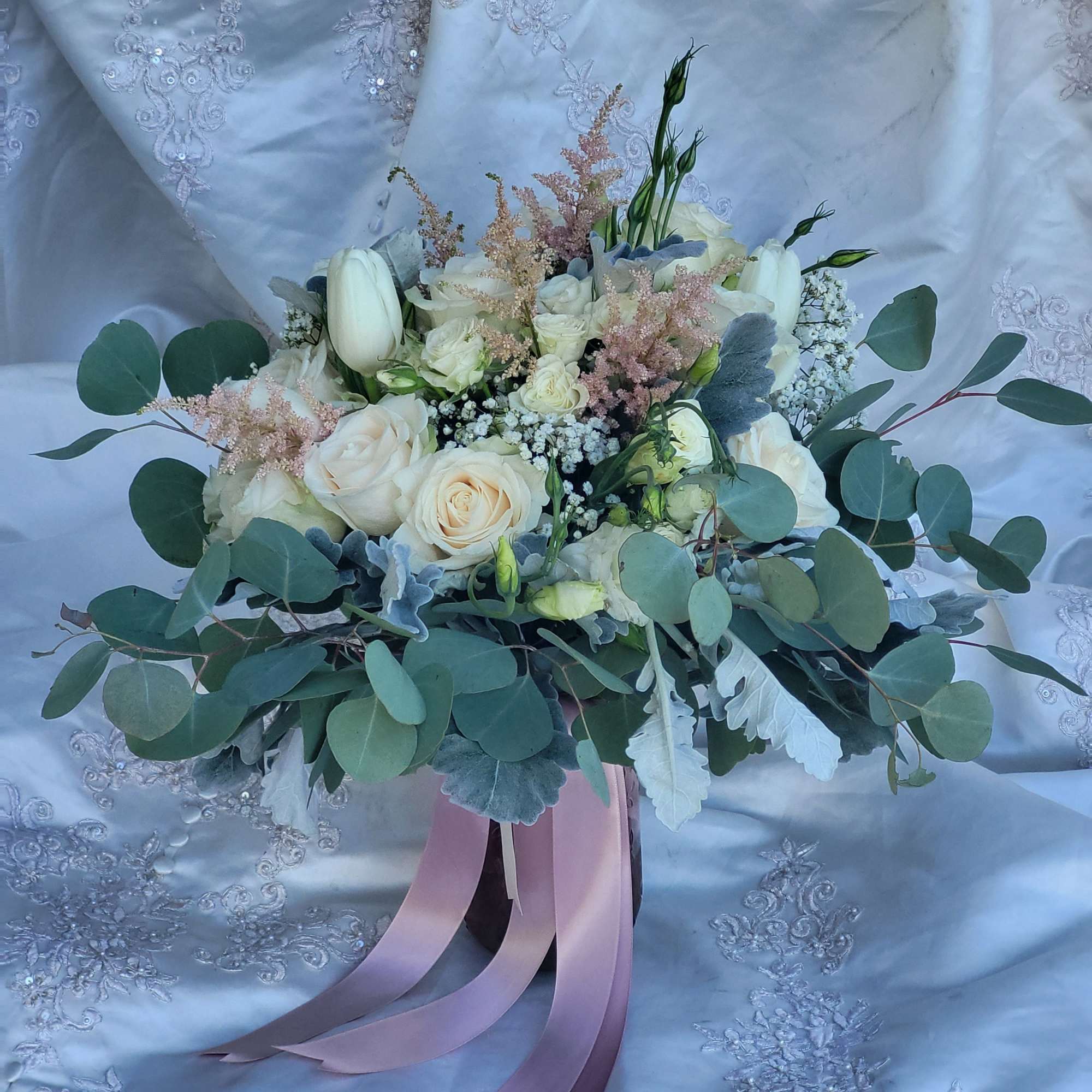 White rose bouquet with eucalyptus and pink ribbon tails