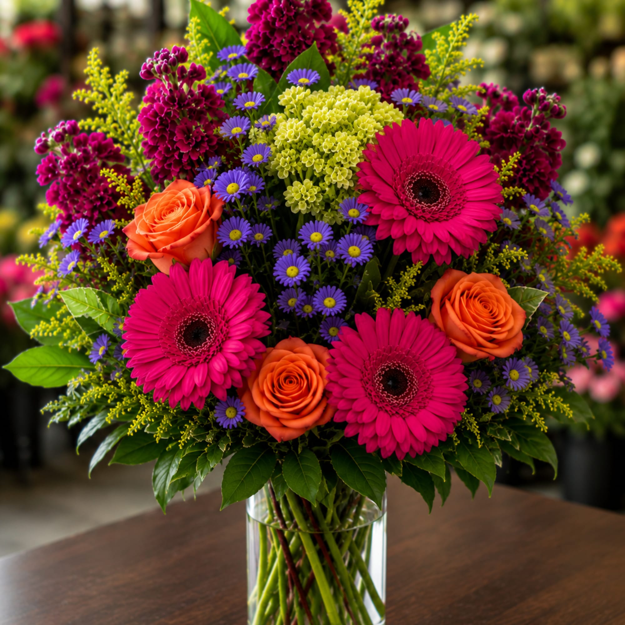 This dramatic display of beautiful blooms screams summertime joy! Lovely orange roses