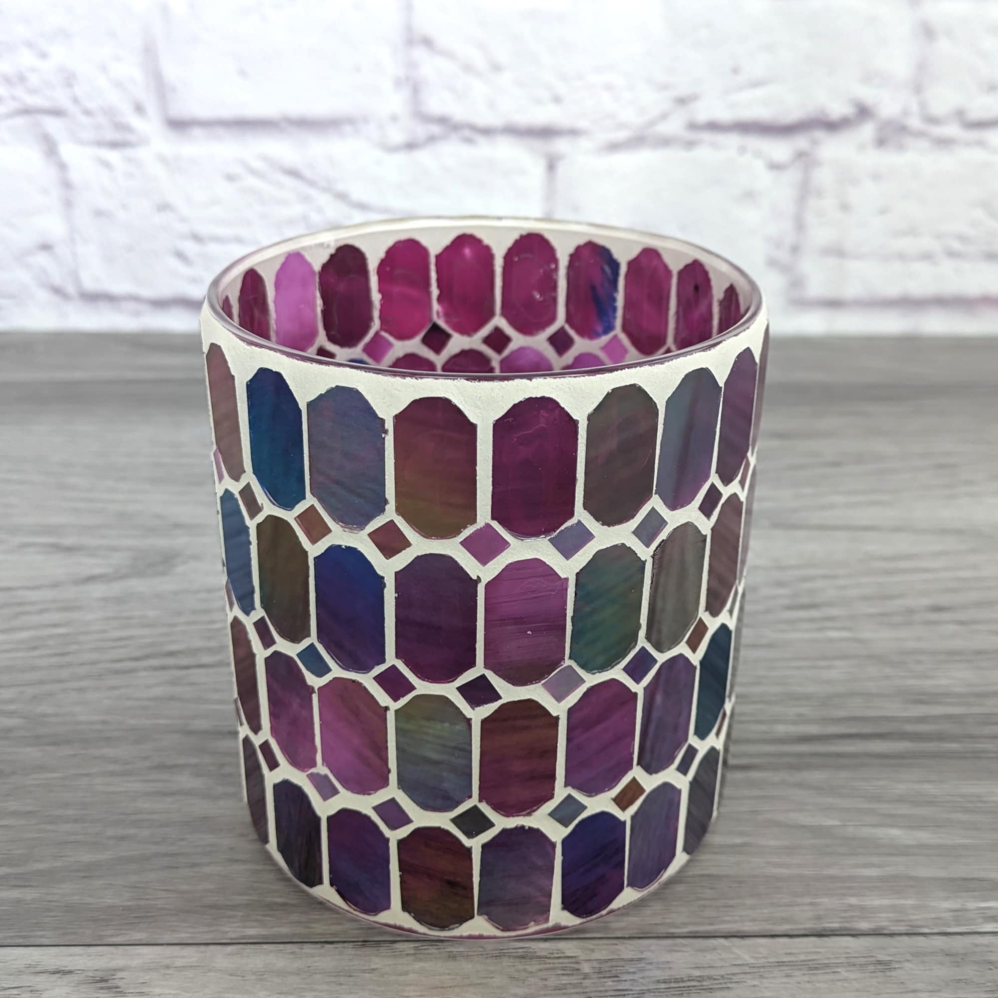 Decorative mosaic glass candle holder in purple and blue tones