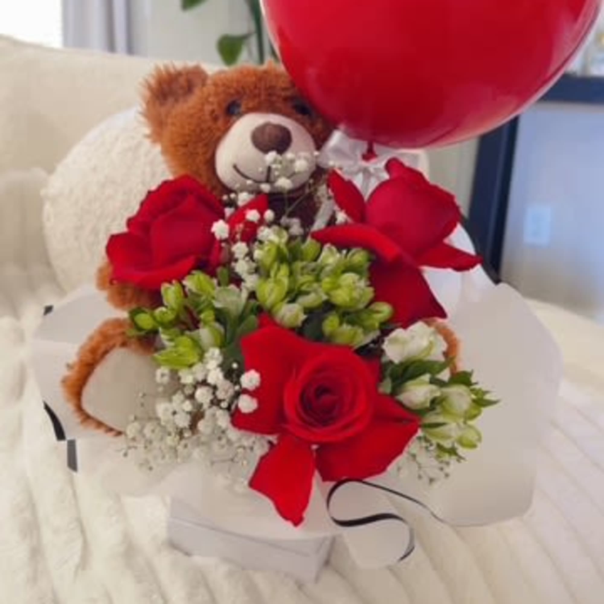 Red rose bouquet with a teddy bear and birthday balloon