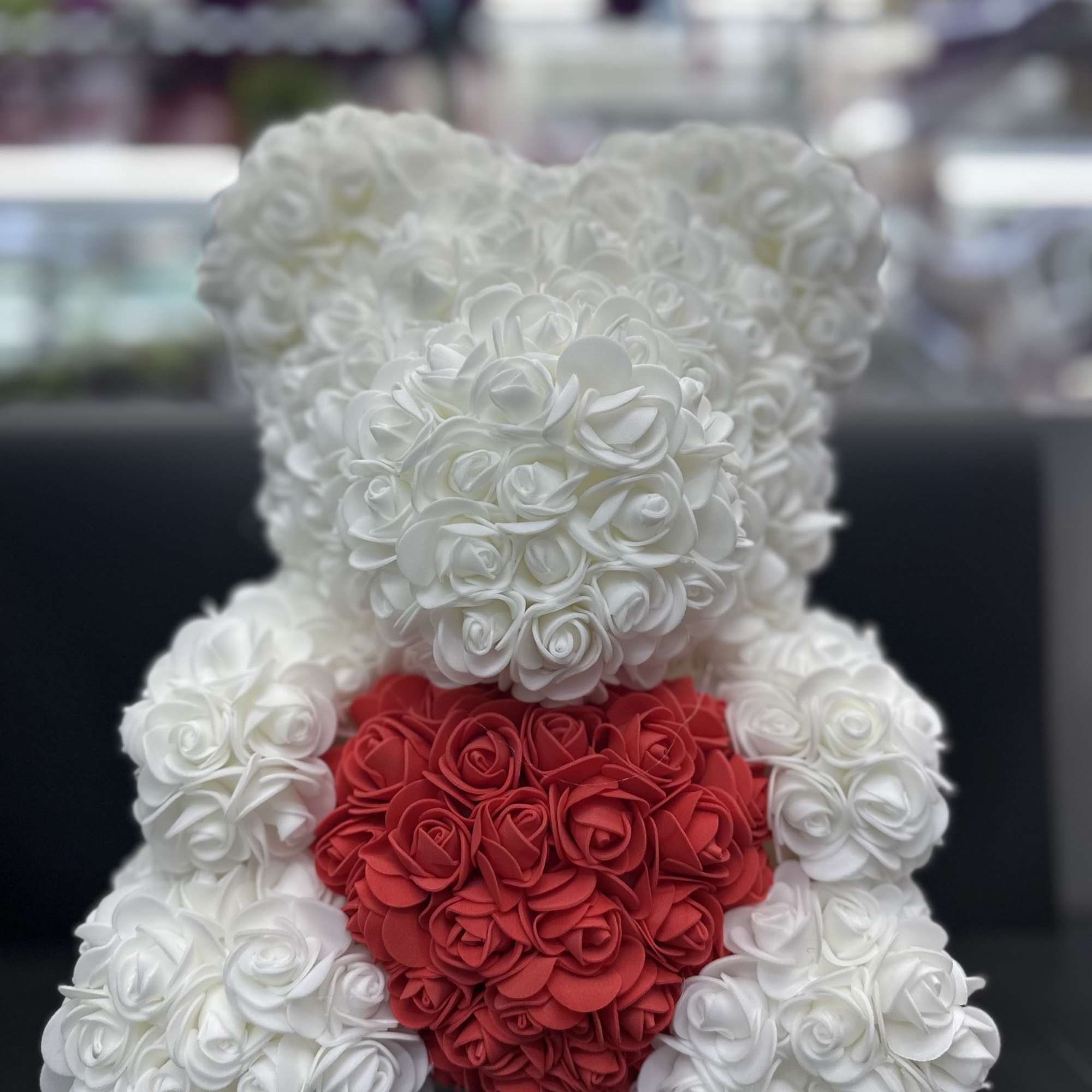 White and red rose teddy bear made of artificial flowers