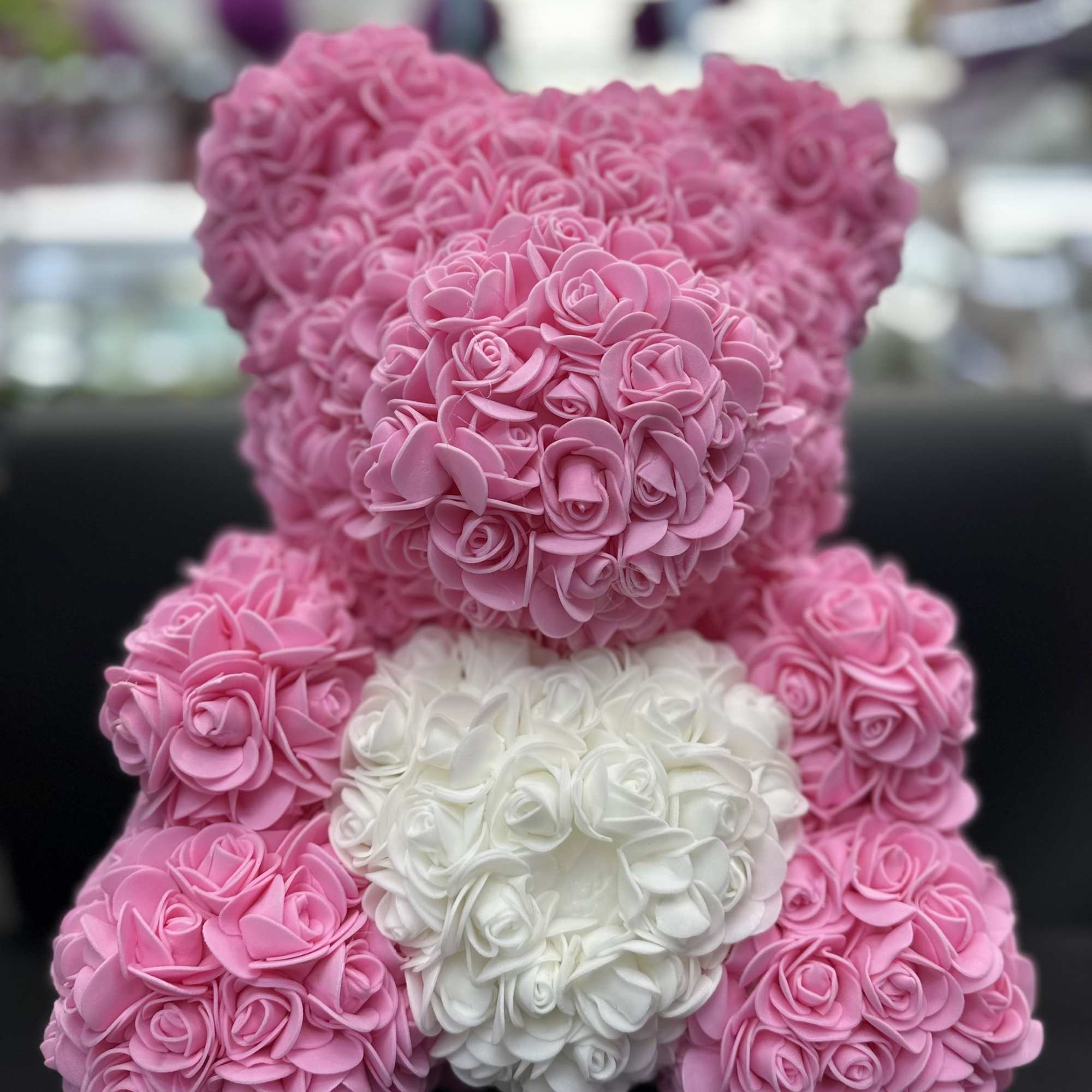 Pink and white rose teddy bear made of artificial flowers