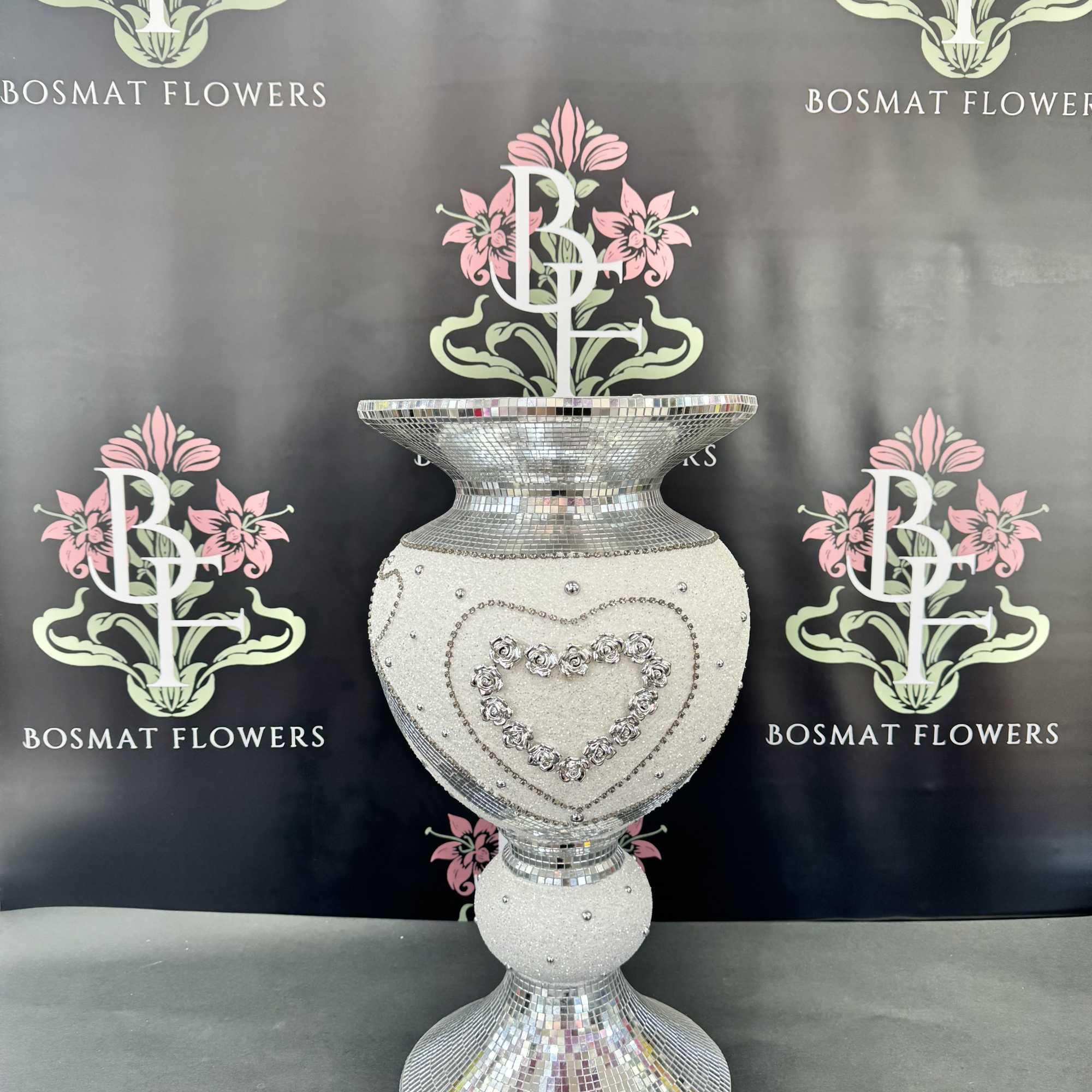 Decorative silver mosaic pedestal vase with a heart design