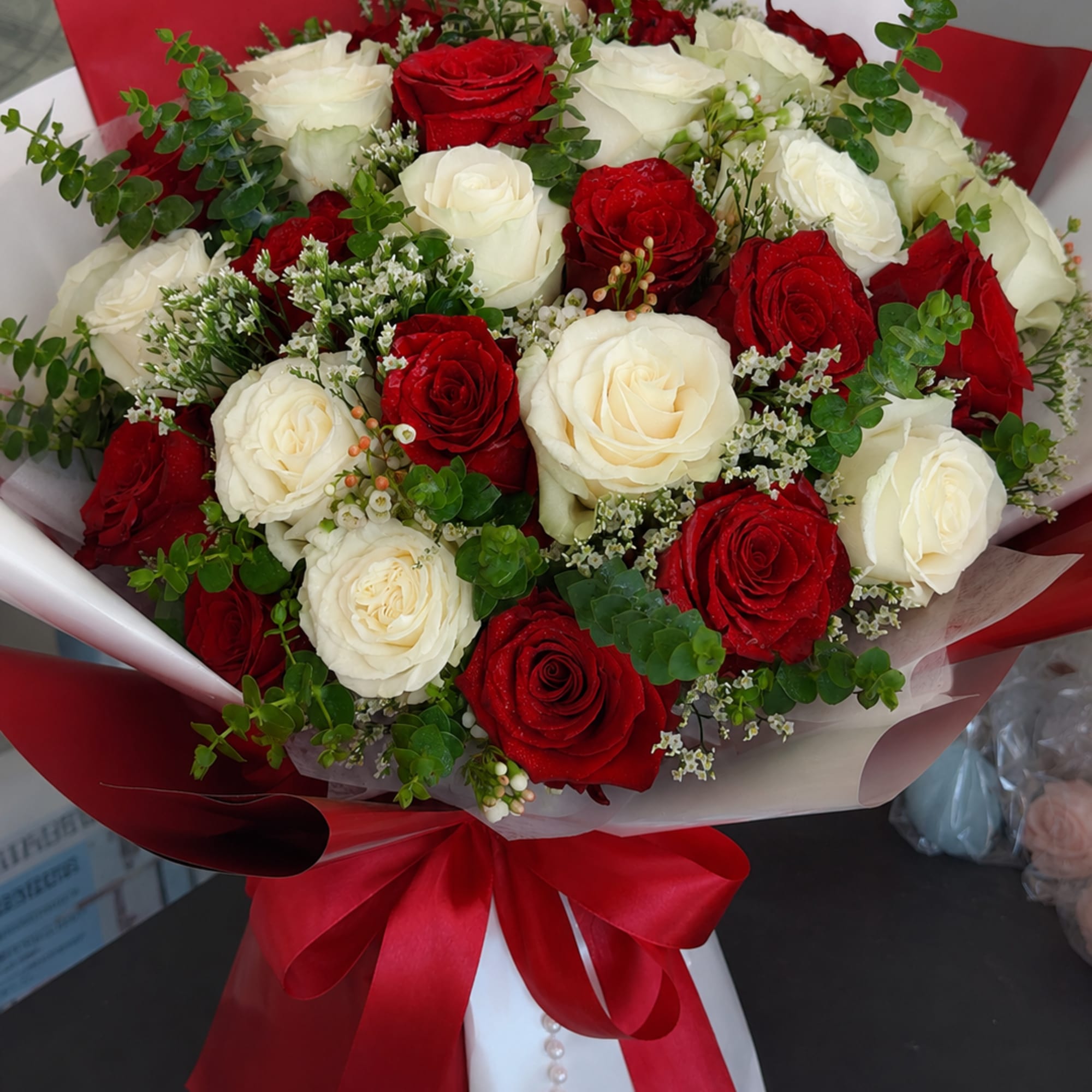 Crimson &amp; Ivory Romance features 15 premium red roses and 15 premium