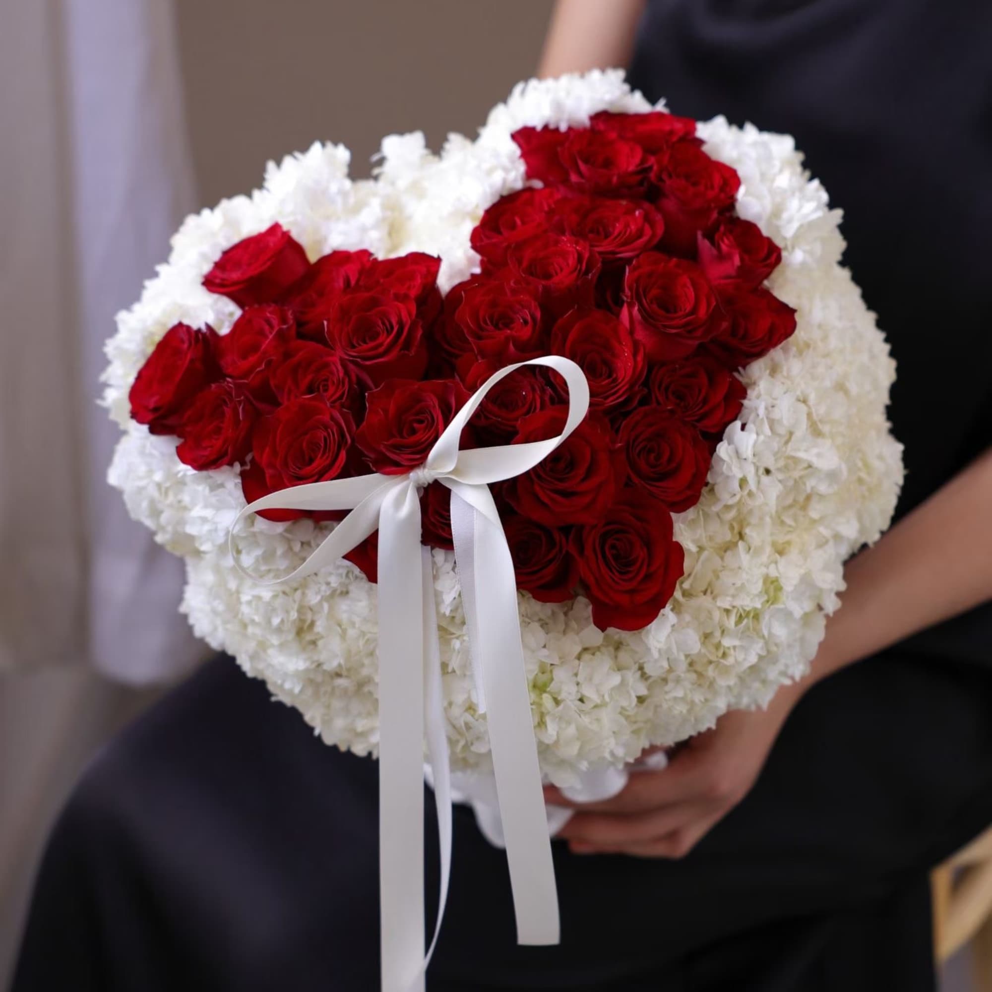 Heart-shaped bouquet of red roses and white flowers with a white ribbon, photo 2 of 4