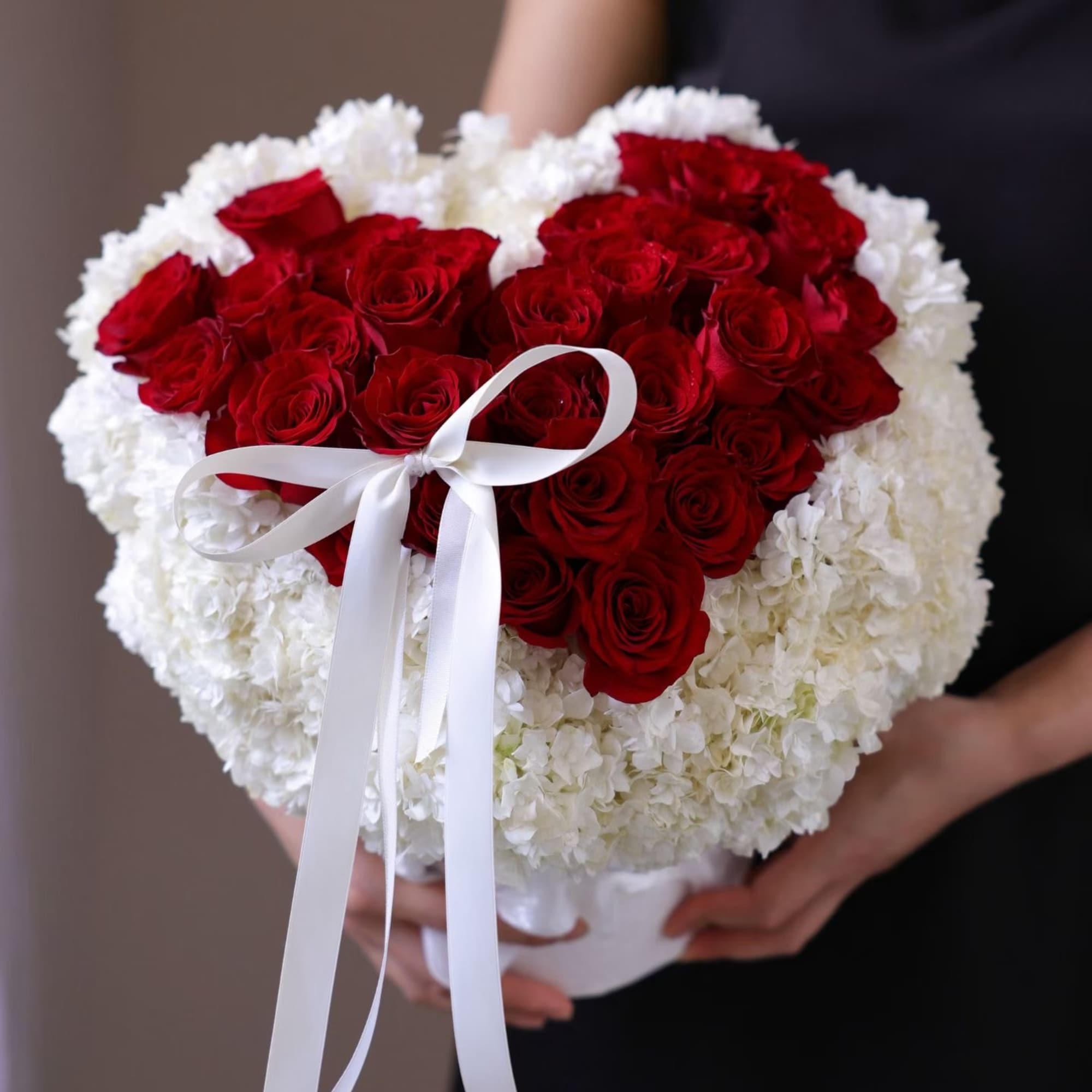 Heart-shaped bouquet of red roses and white flowers with a white ribbon, photo 3 of 4