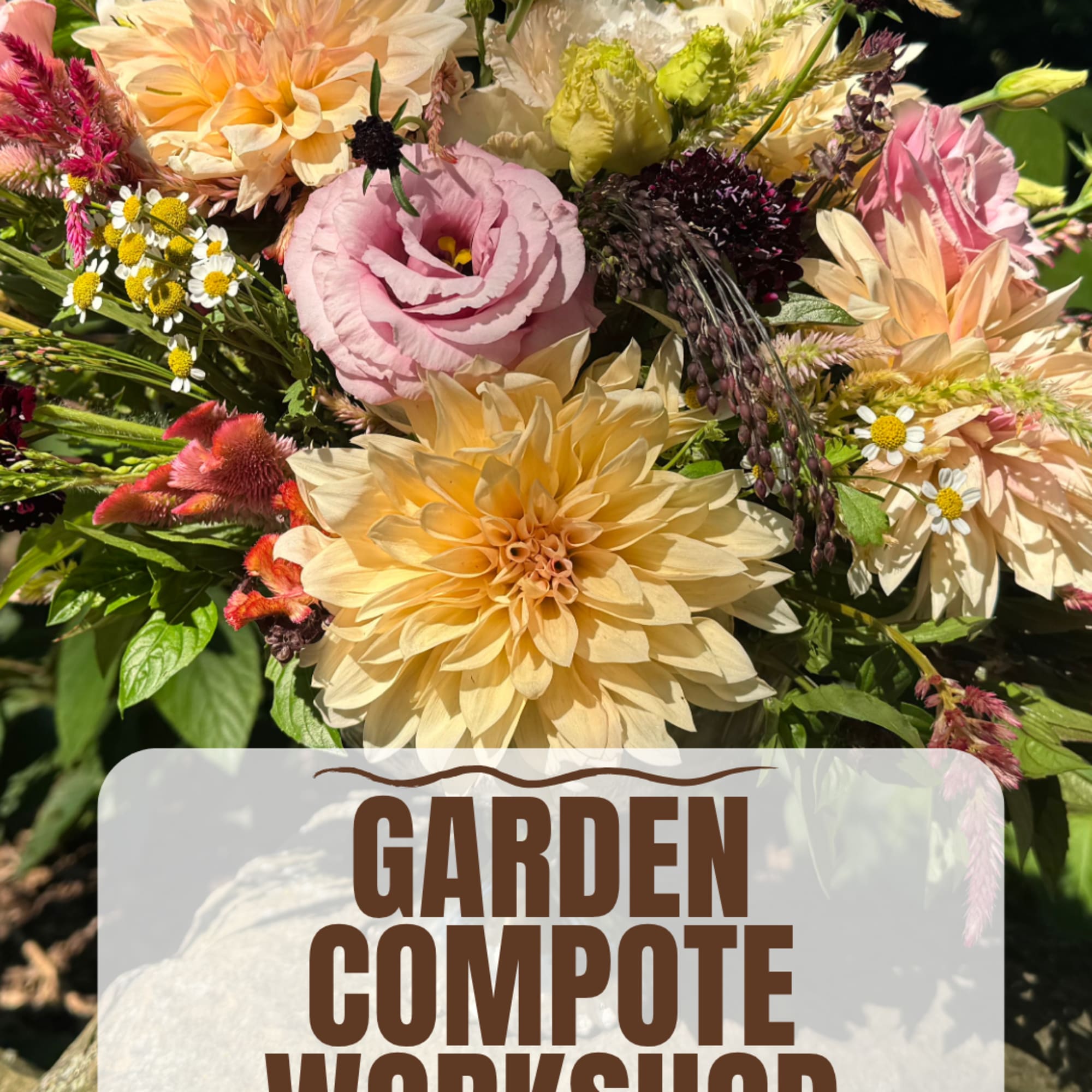 Mixed bouquet of peach, pink, and cream flowers with a workshop sign