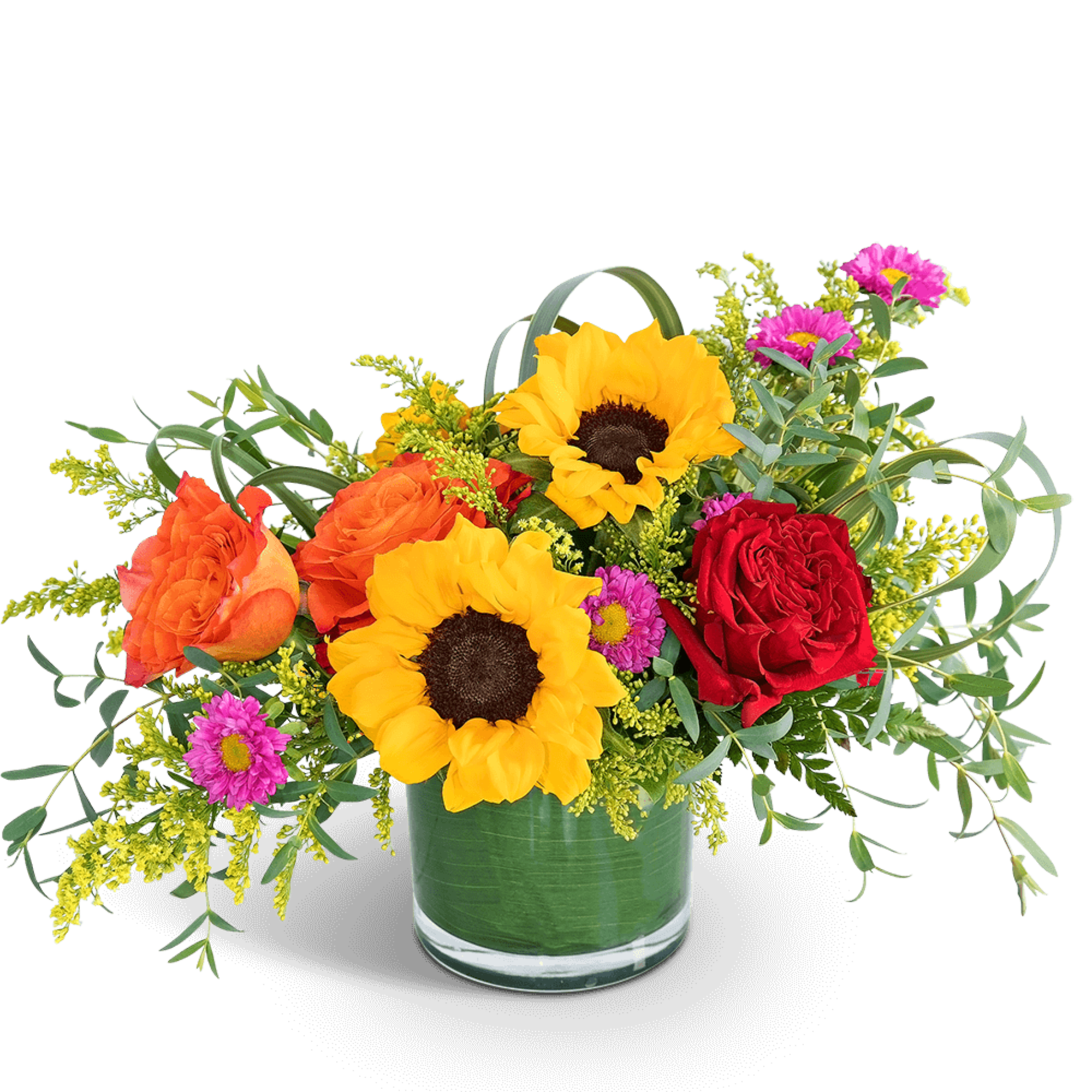 Bright mixed bouquet in a glass vase with sunflowers, roses, and pink daisies