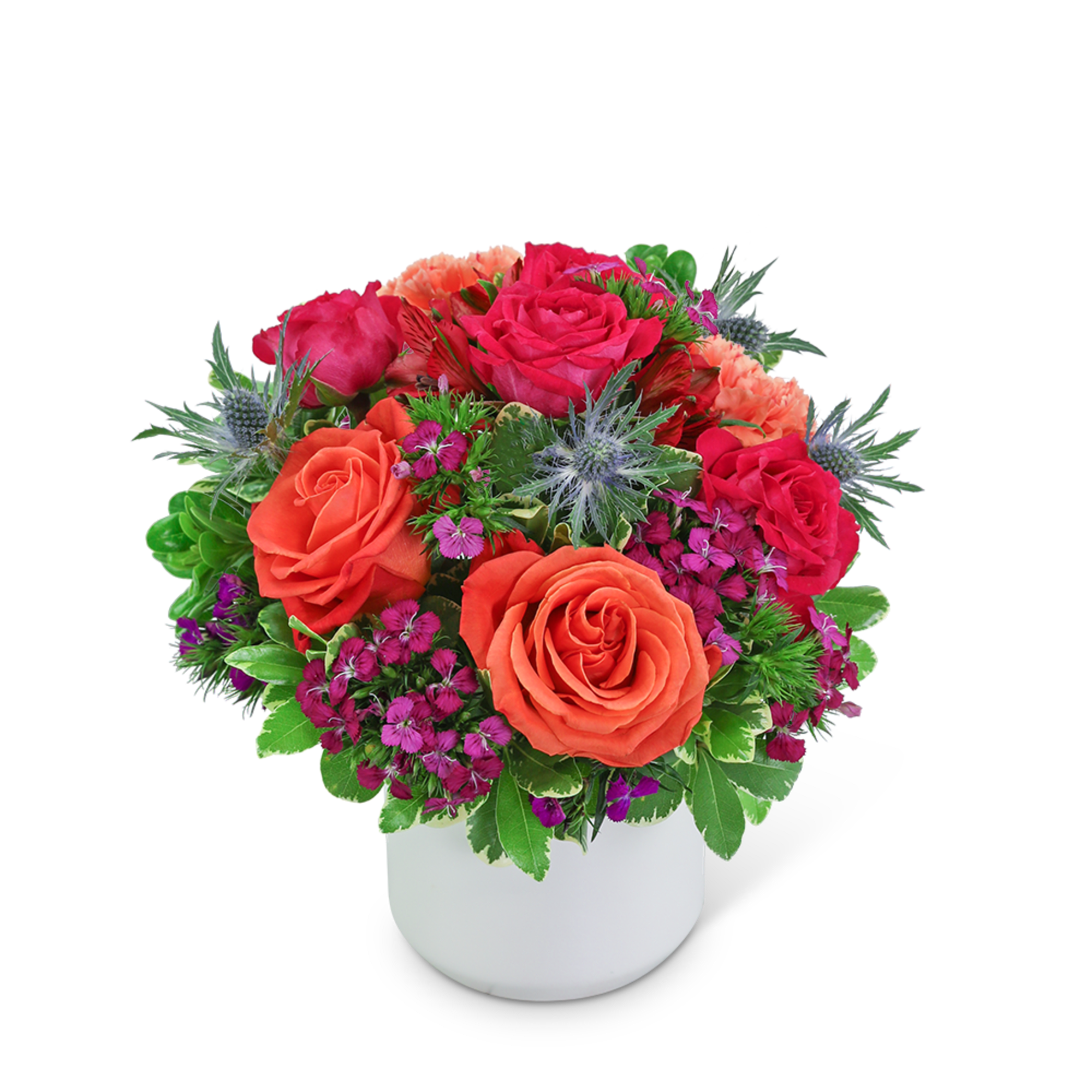 Bright mixed bouquet of roses and small purple flowers in a white vase