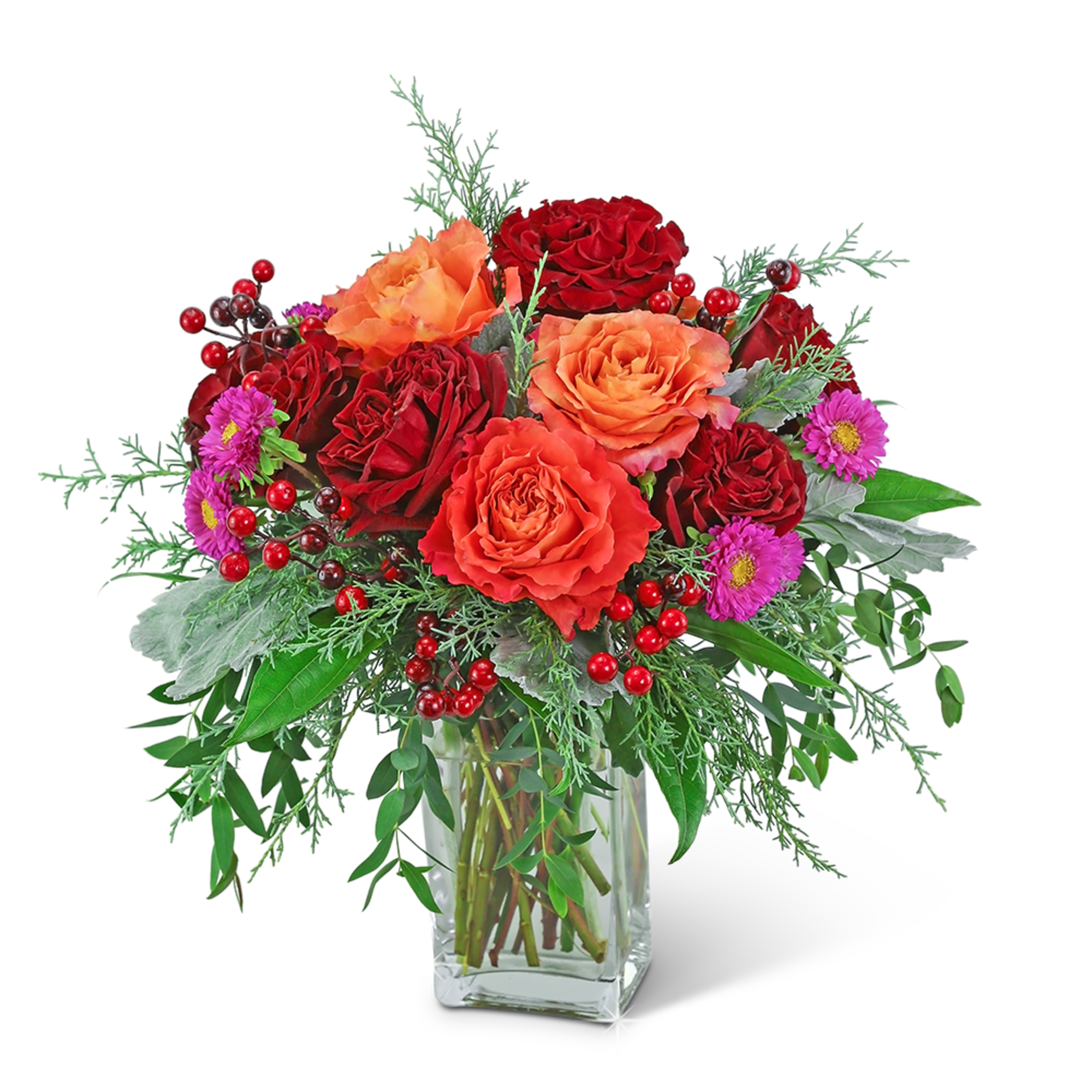 Red and orange roses in a clear glass vase with purple flowers