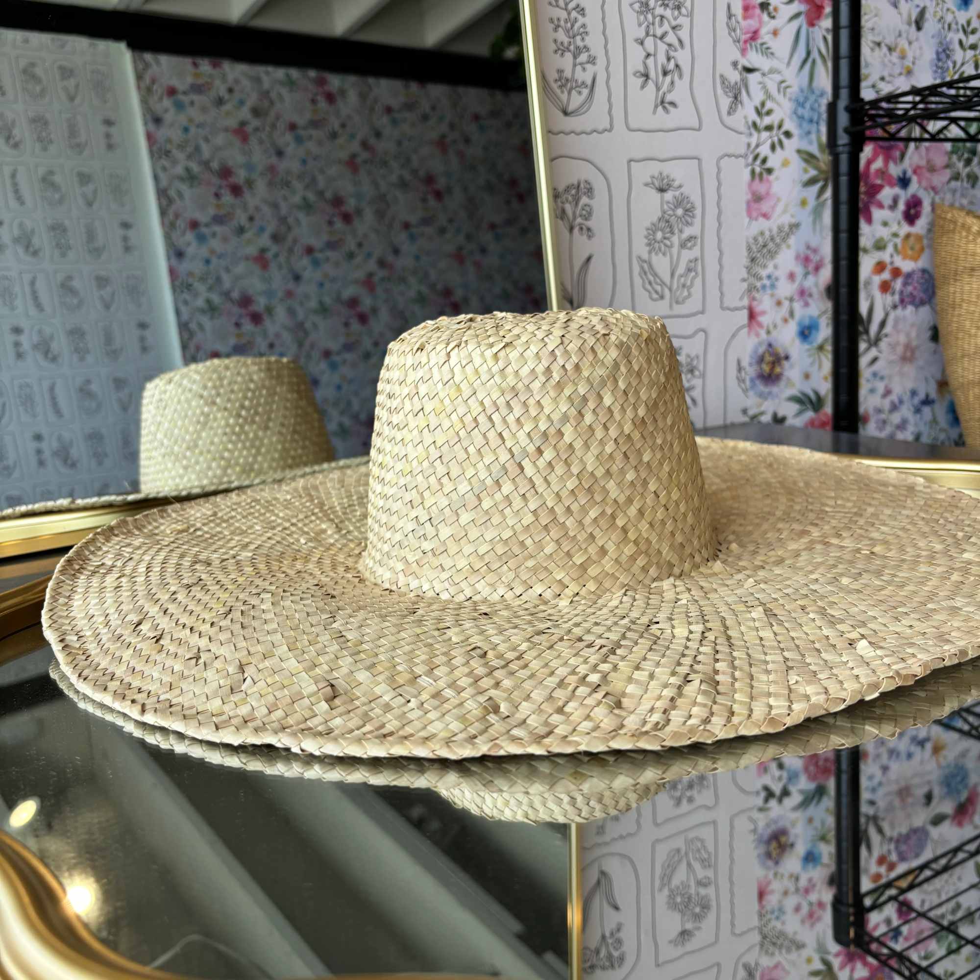 Straw sun hat with a wide brim and woven crown