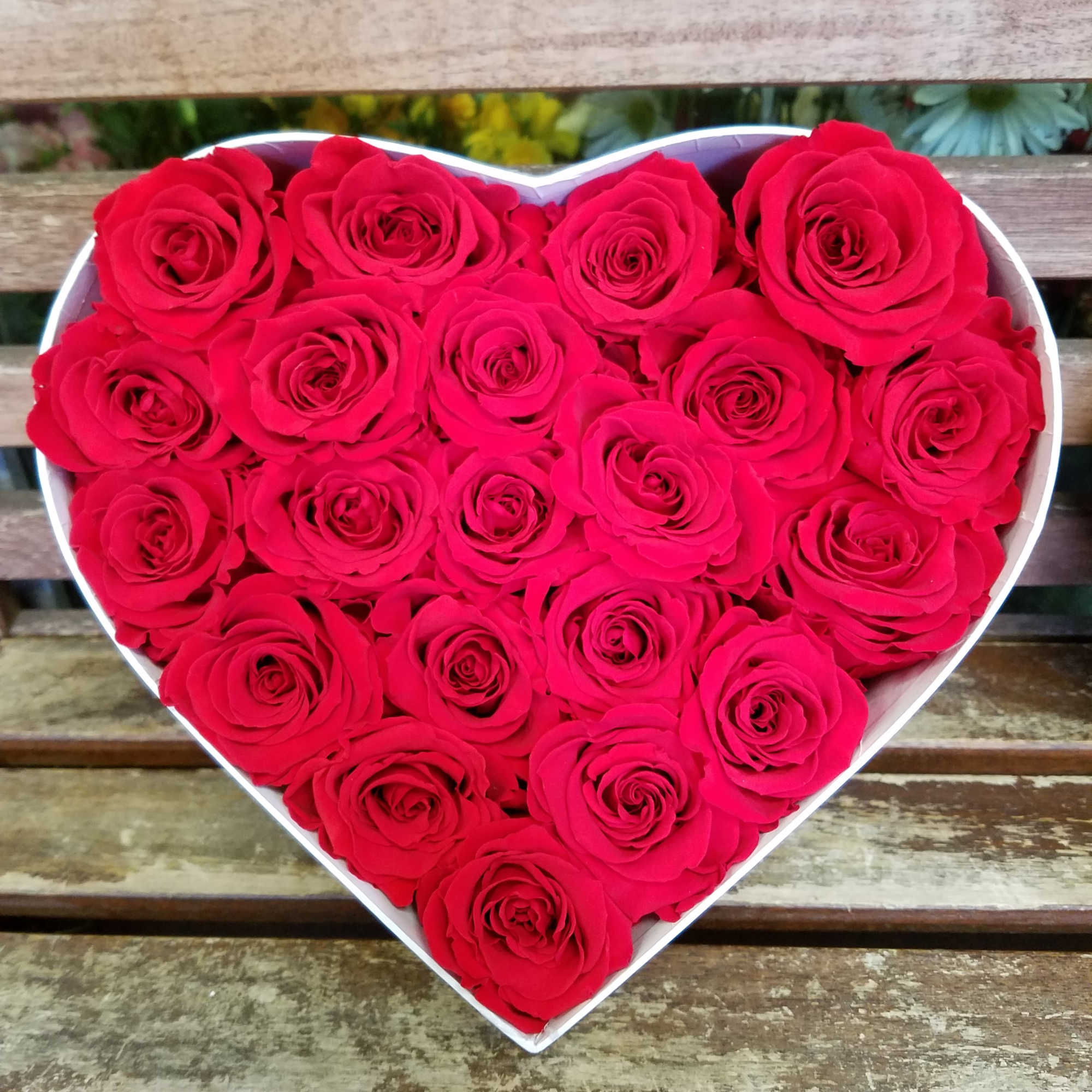Heart-shaped box filled with red roses, photo 5 of 6