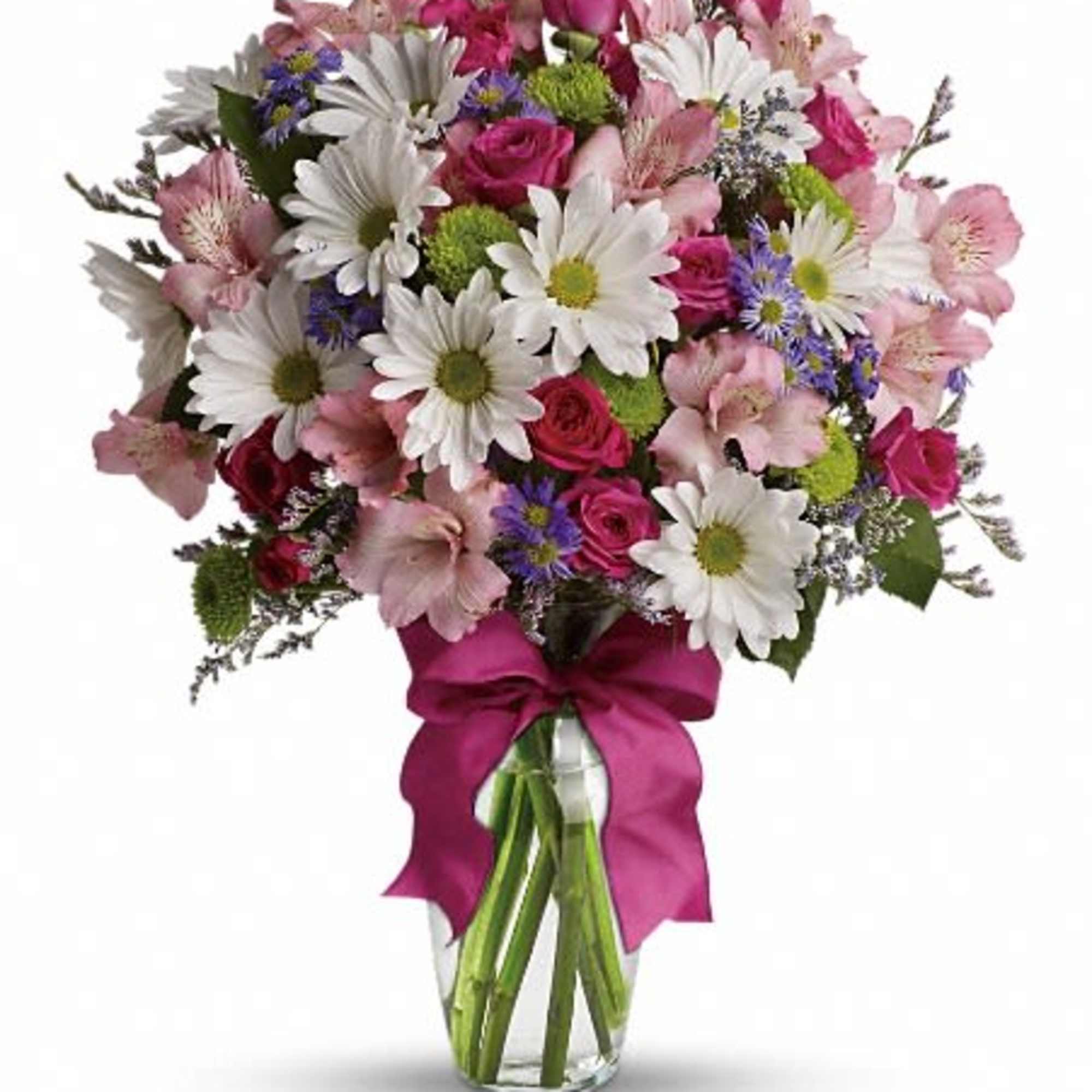 Bouquet of pink and white flowers in a clear glass vase with a magenta ribbon