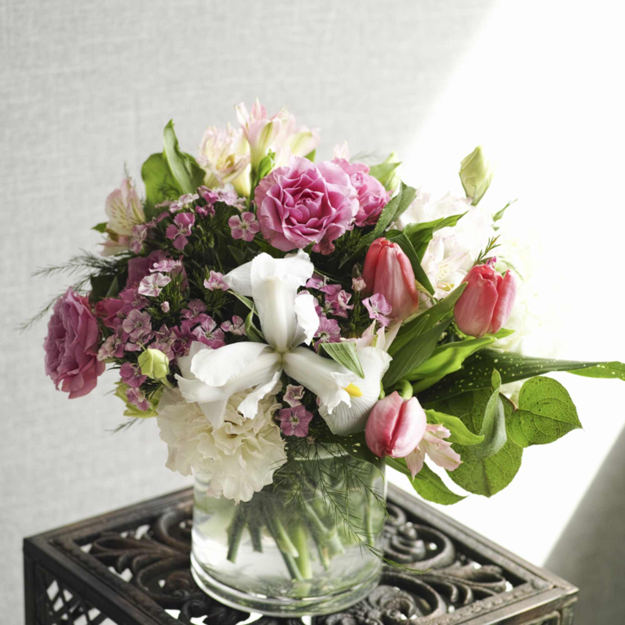 Pink and white mixed bouquet in a clear glass vase, photo 2 of 2