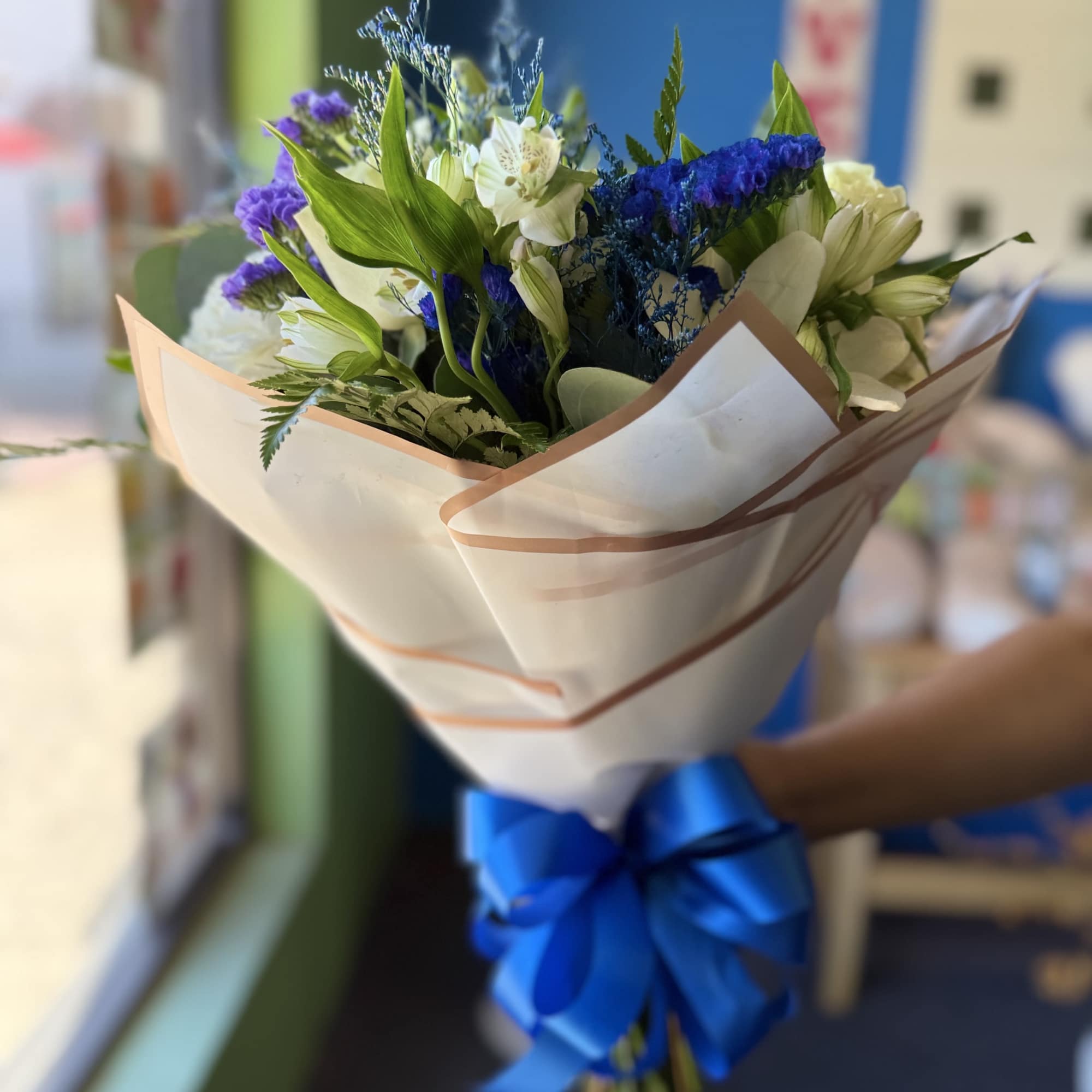 This blue-wrapped bouquet features a 'buchon' style and will include the same, photo 2 of 2