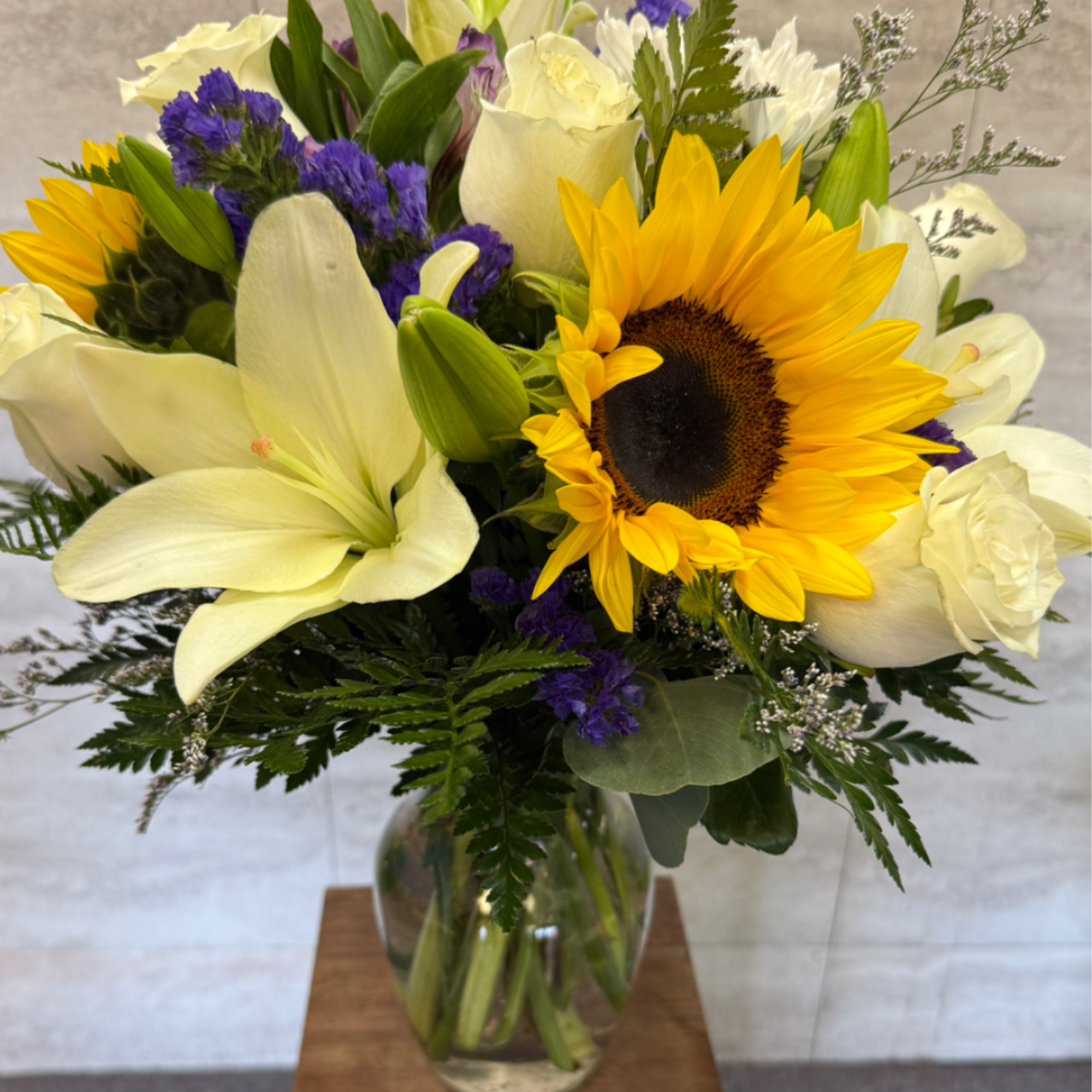 (ALL-ROUND) Sunflowers with an assortment of other flowers, giving it a soft