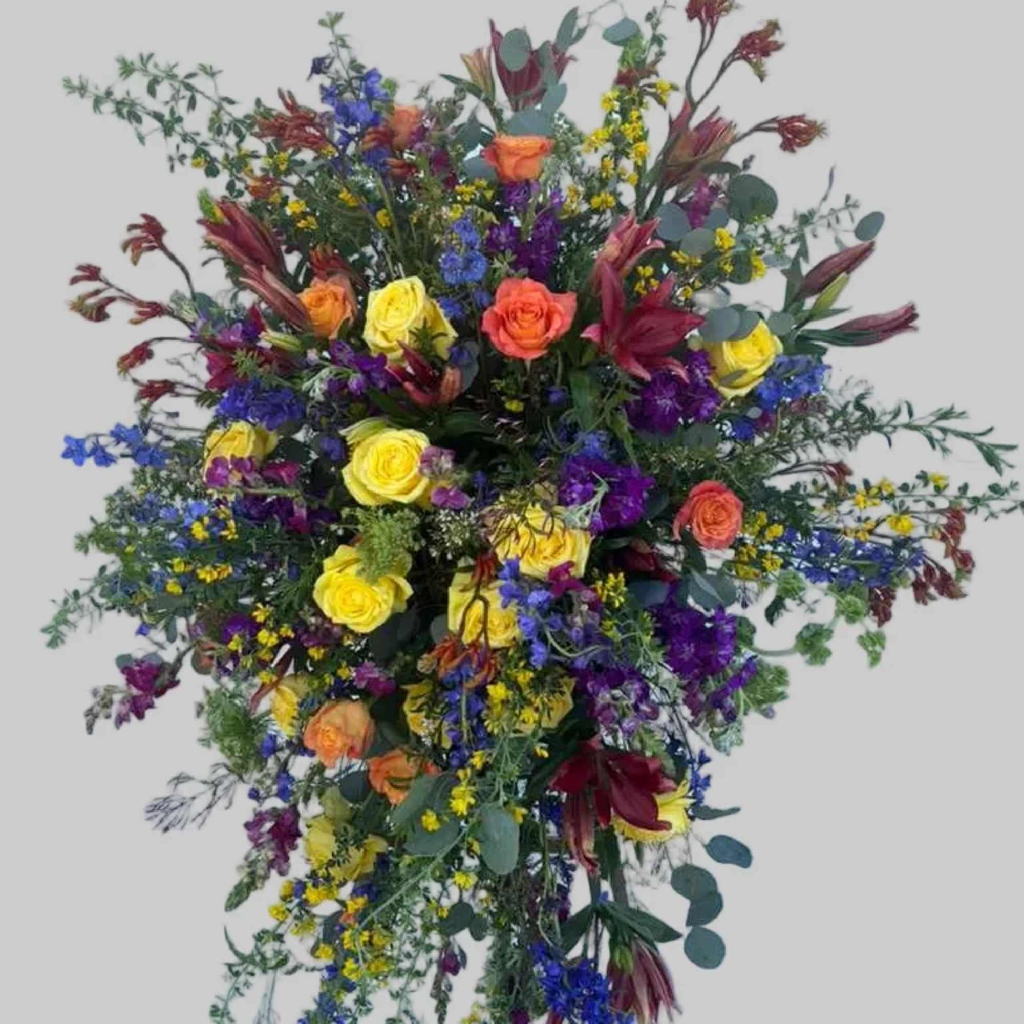 Large standing spray with multicolored roses and lilies