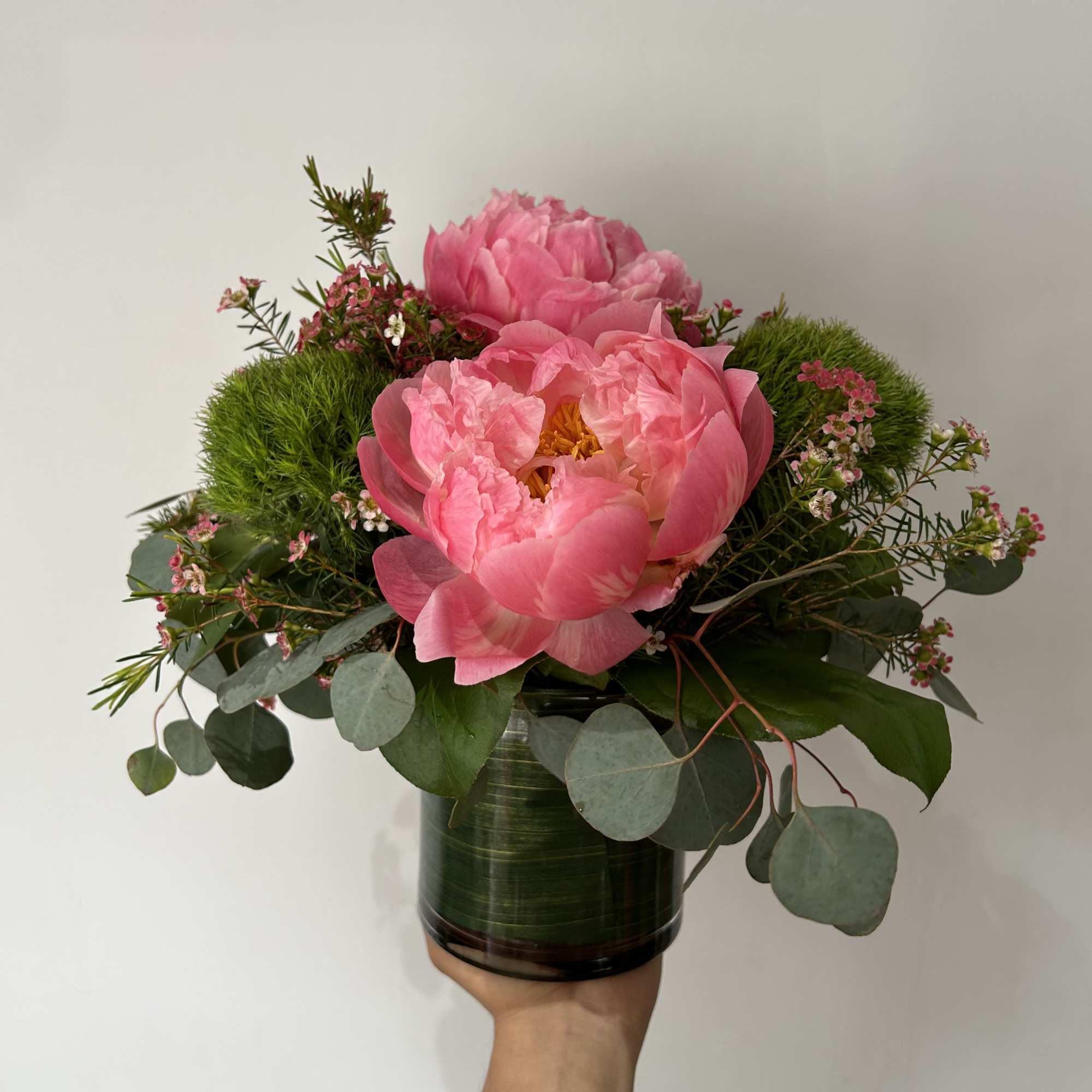 Seasonal peonies arranged with fillers and greens in a vase. , photo 2 of 2
