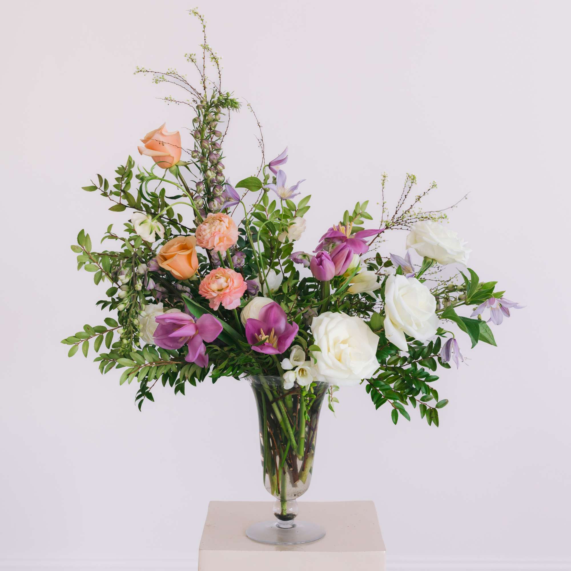 A true showstopper designed in an elegant footed glass vase.  A, photo 2 of 2