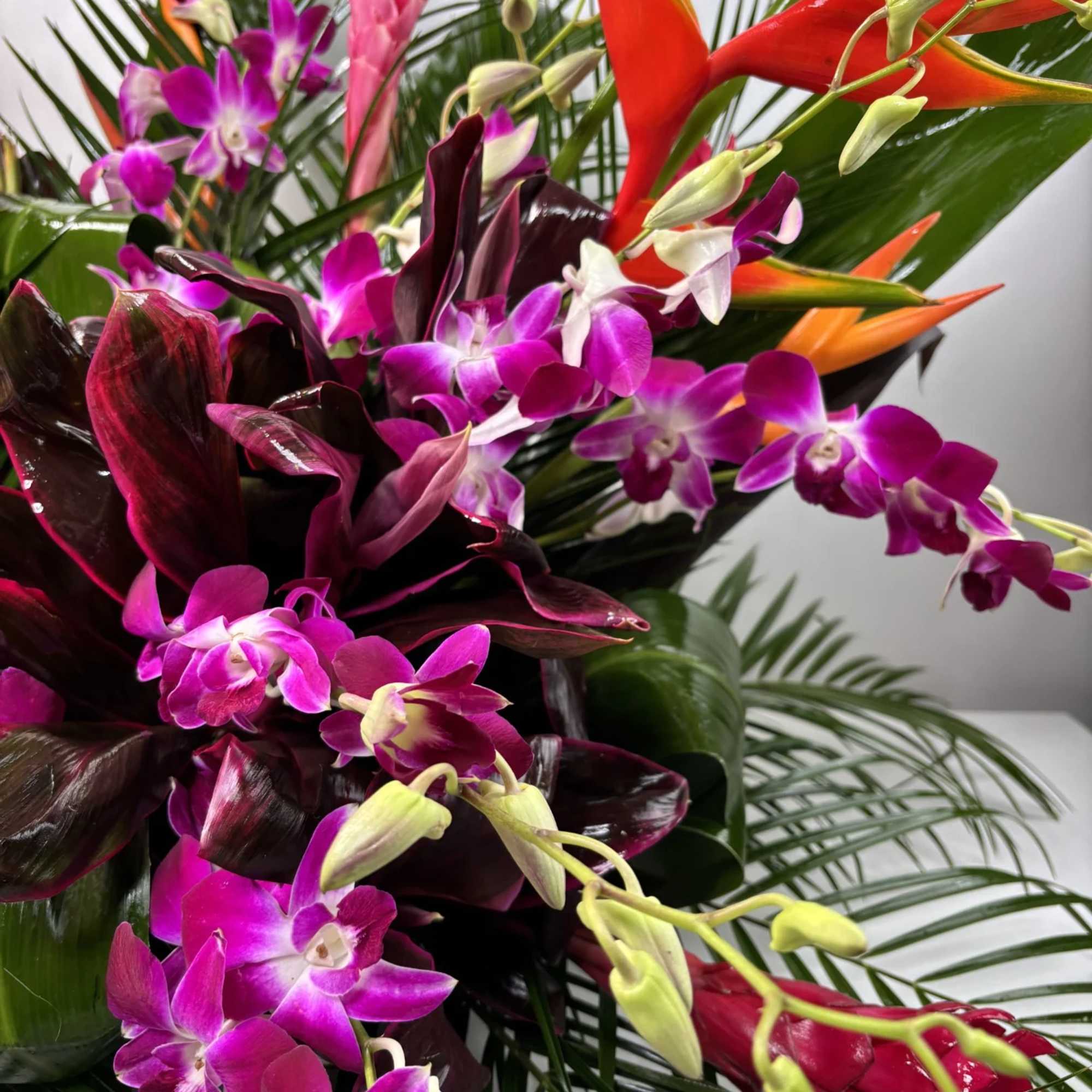 Tropical bouquet with purple orchids and red-orange heliconia