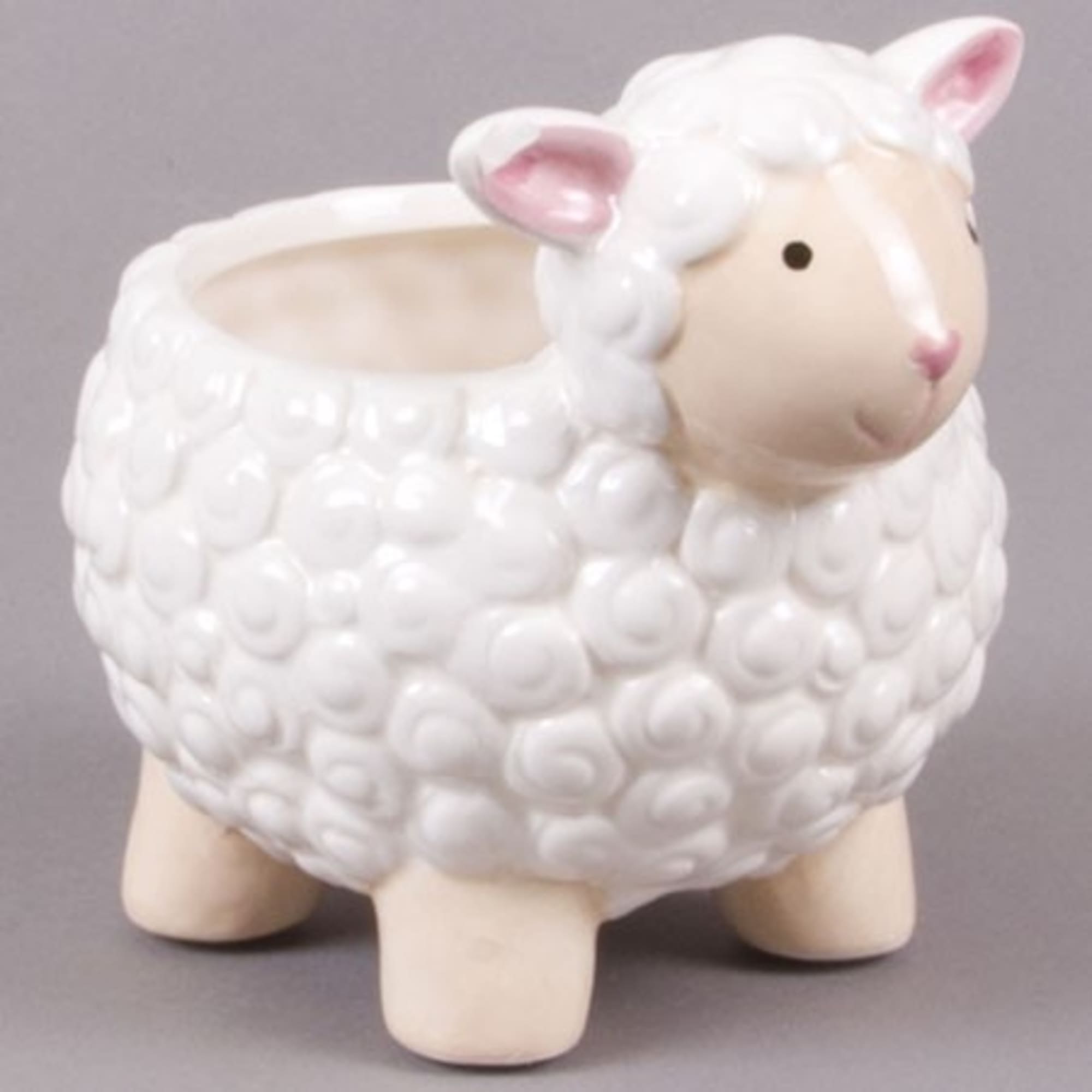 White sheep-shaped ceramic planter with pink ears