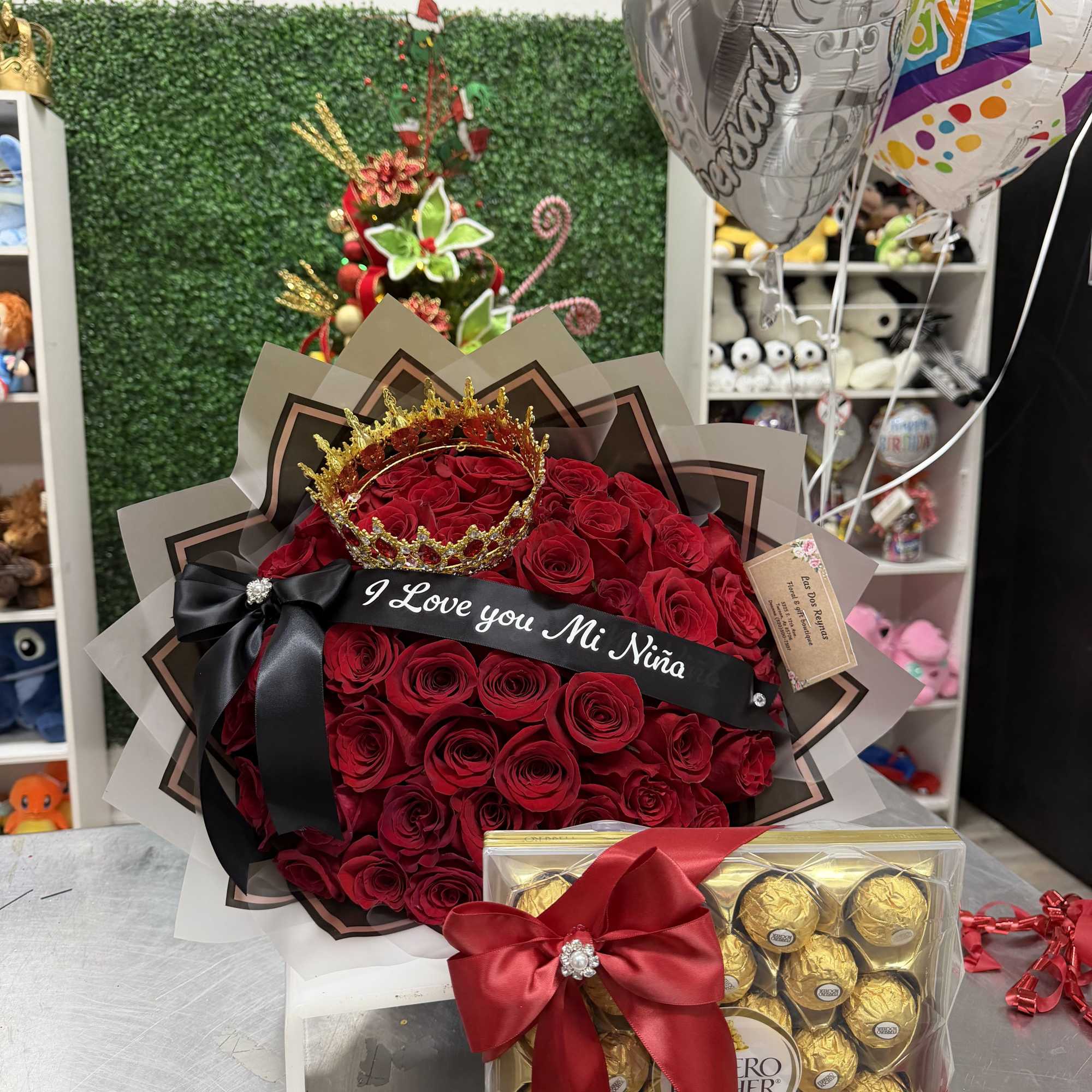 long stem Red rose accented with a Red and gold crown finished