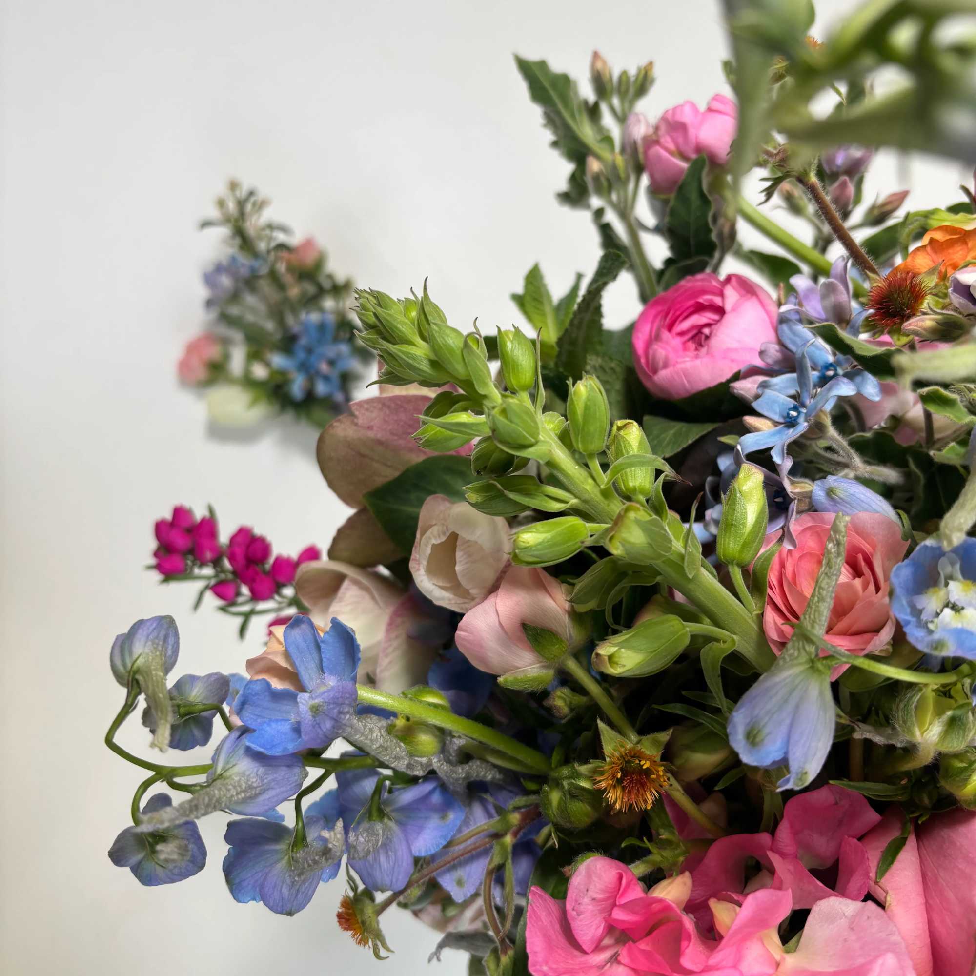 Colorful bouquet with pink, blue, and purple flowers