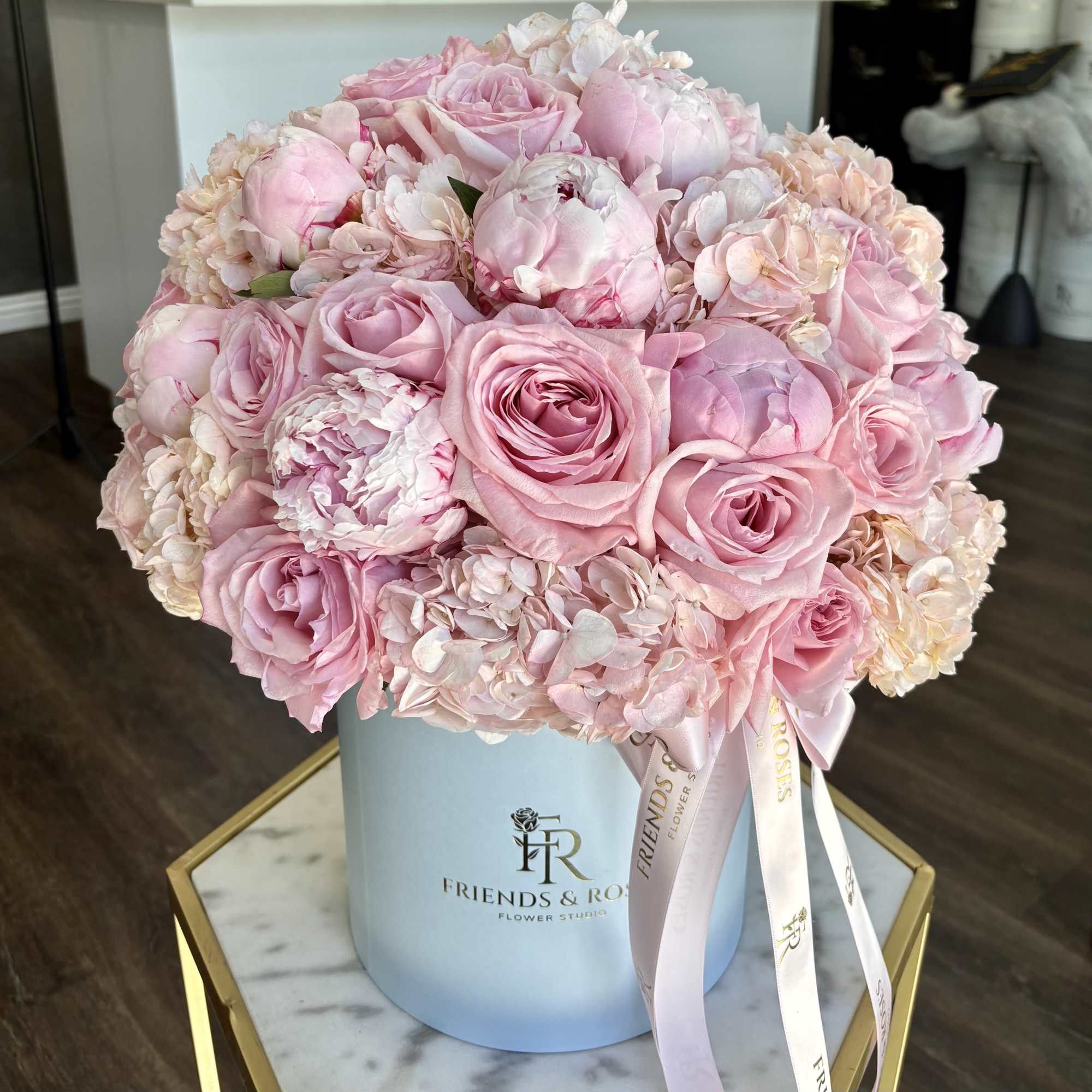 A beautiful arrangement of blush garden roses, peonies, and hydrangeas, artfully designed, photo 3 of 3