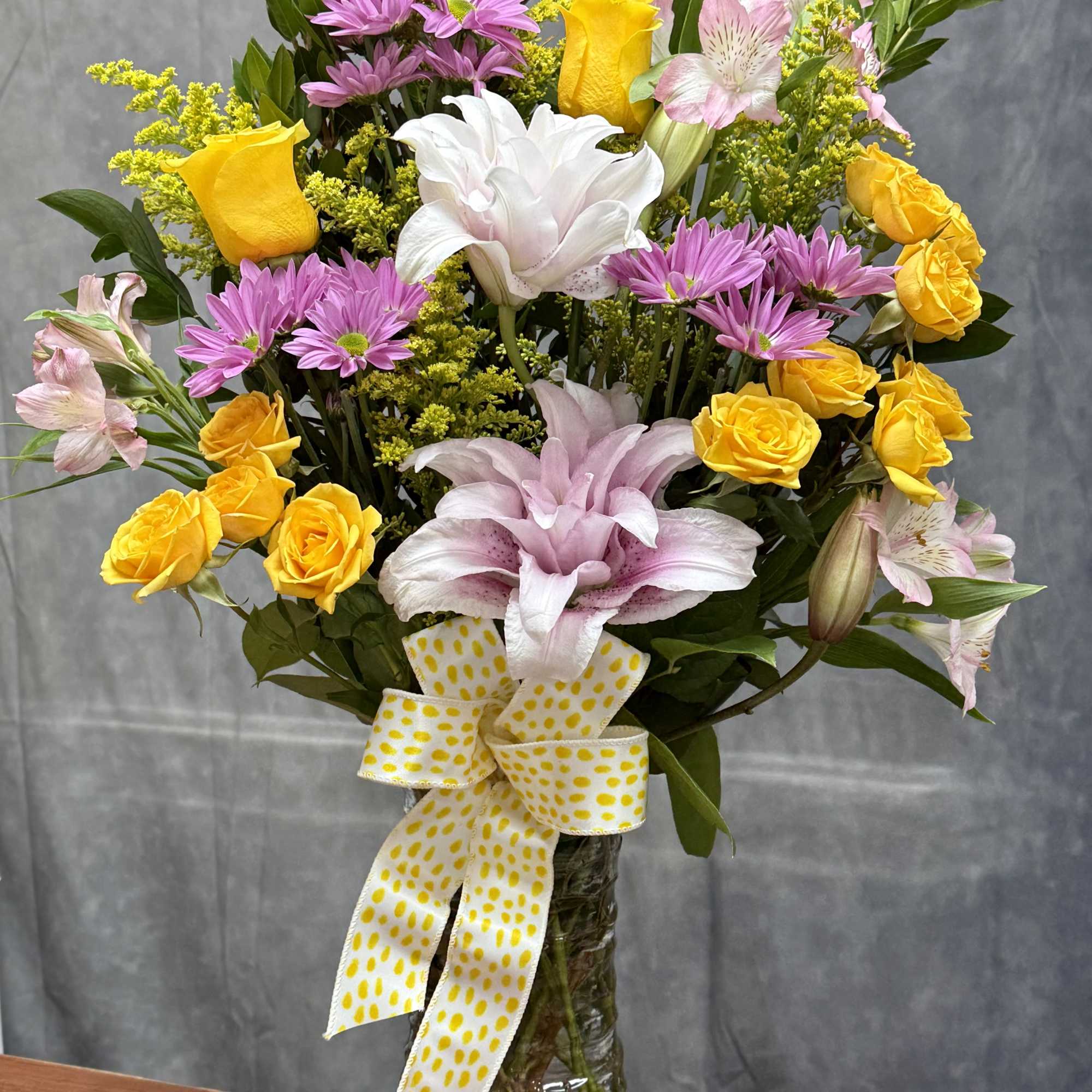 A charming mix of soft pink roses, delicate lavender buttons, sunny yellow, photo 2 of 2