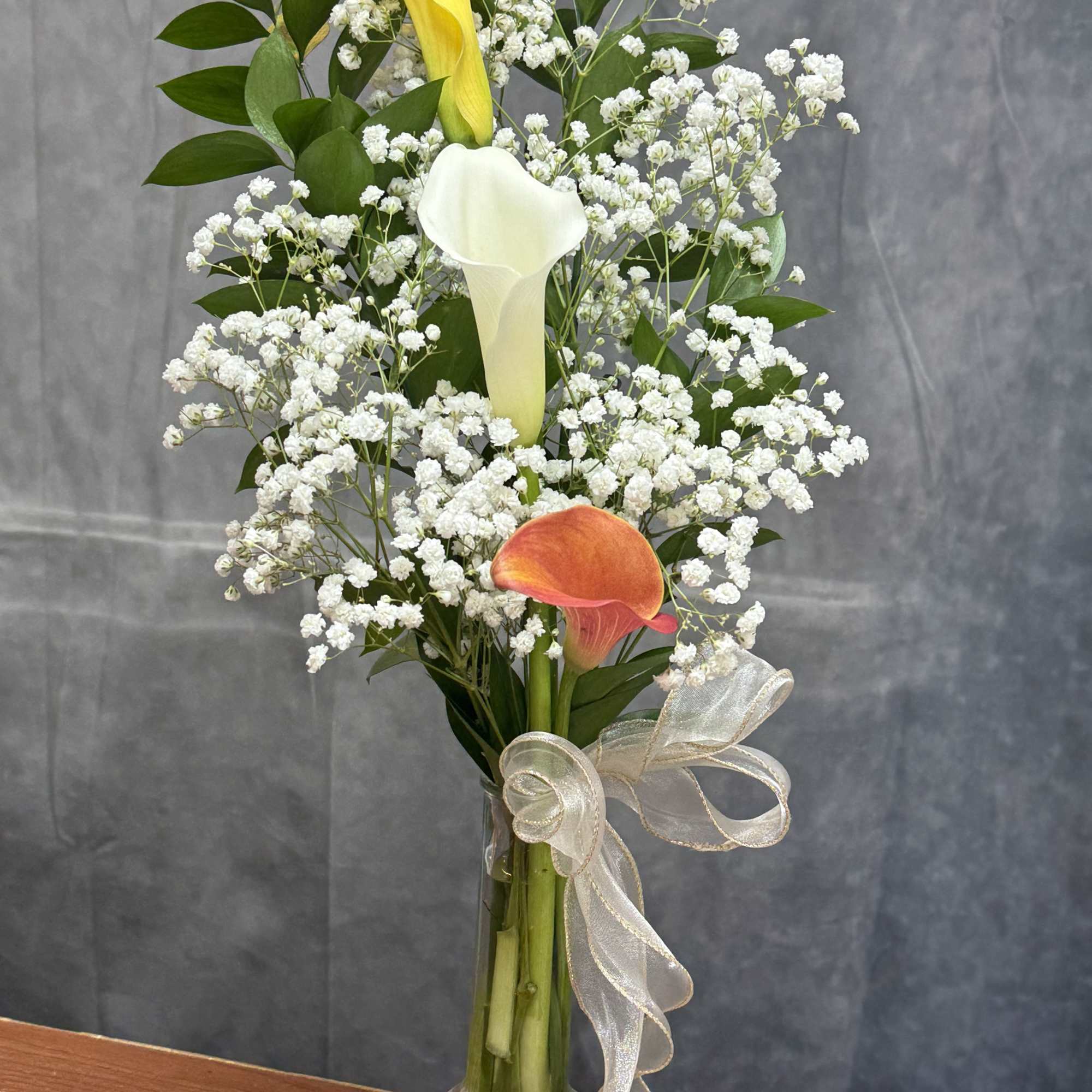Elegant and timeless, this charming vase arrangement features a beautiful mix of