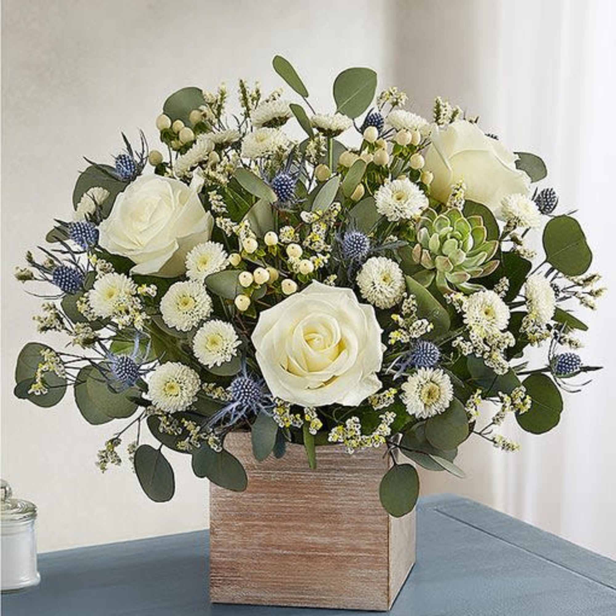 White roses, thistle blue,white limonium, white button pom,cream hypericum, succulent, eucalyptus silver, photo 3 of 3