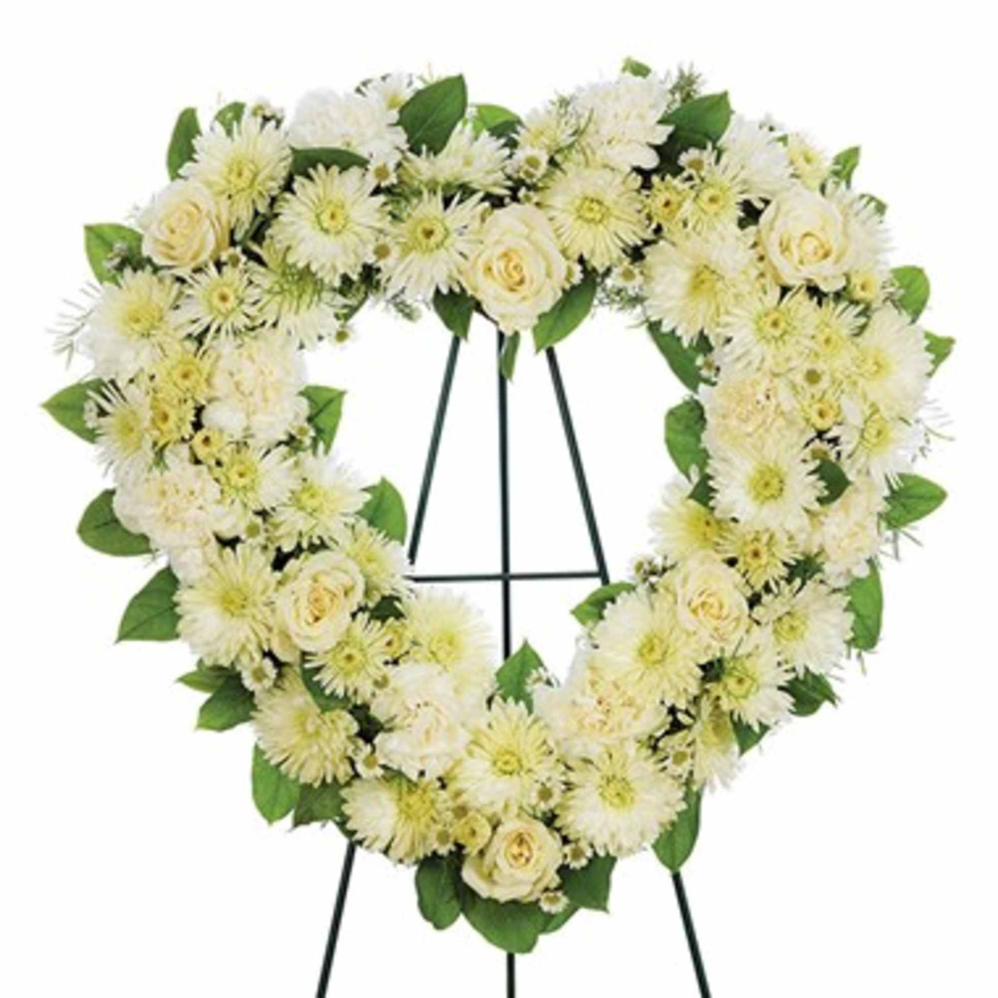Heart-shaped white floral wreath on a stand