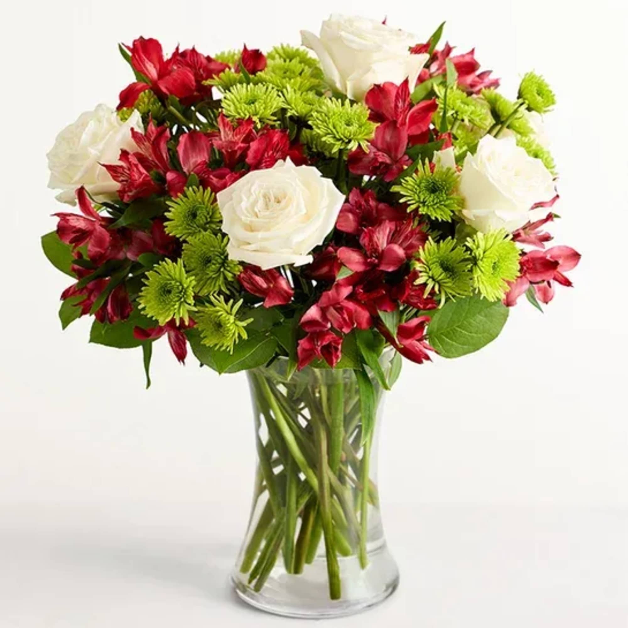 Bouquet of red and white flowers in a clear glass vase