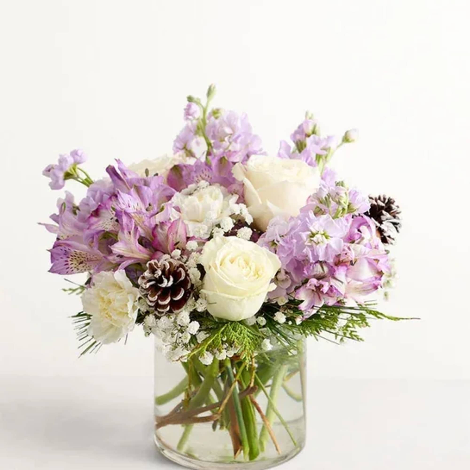 Lavender and white bouquet in a clear glass vase