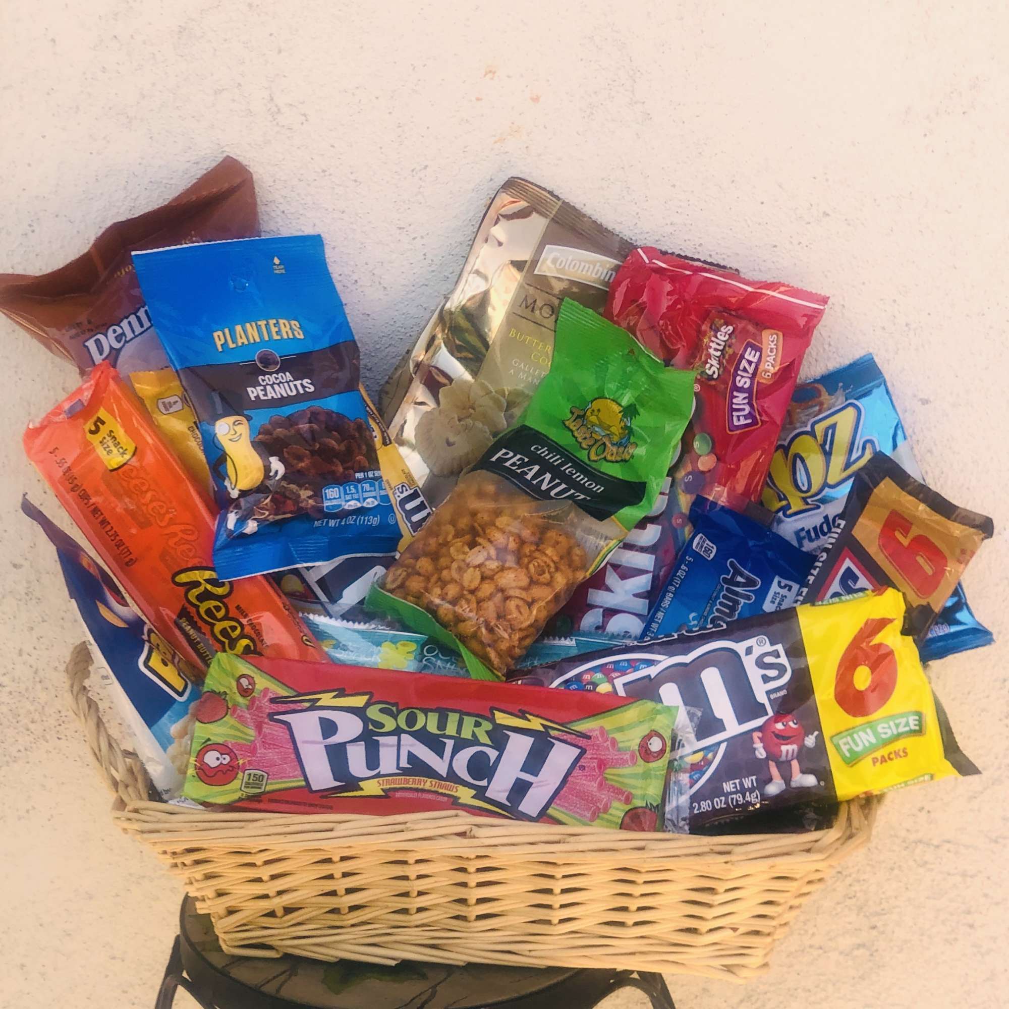 Basket filled with assorted candy and snack bags