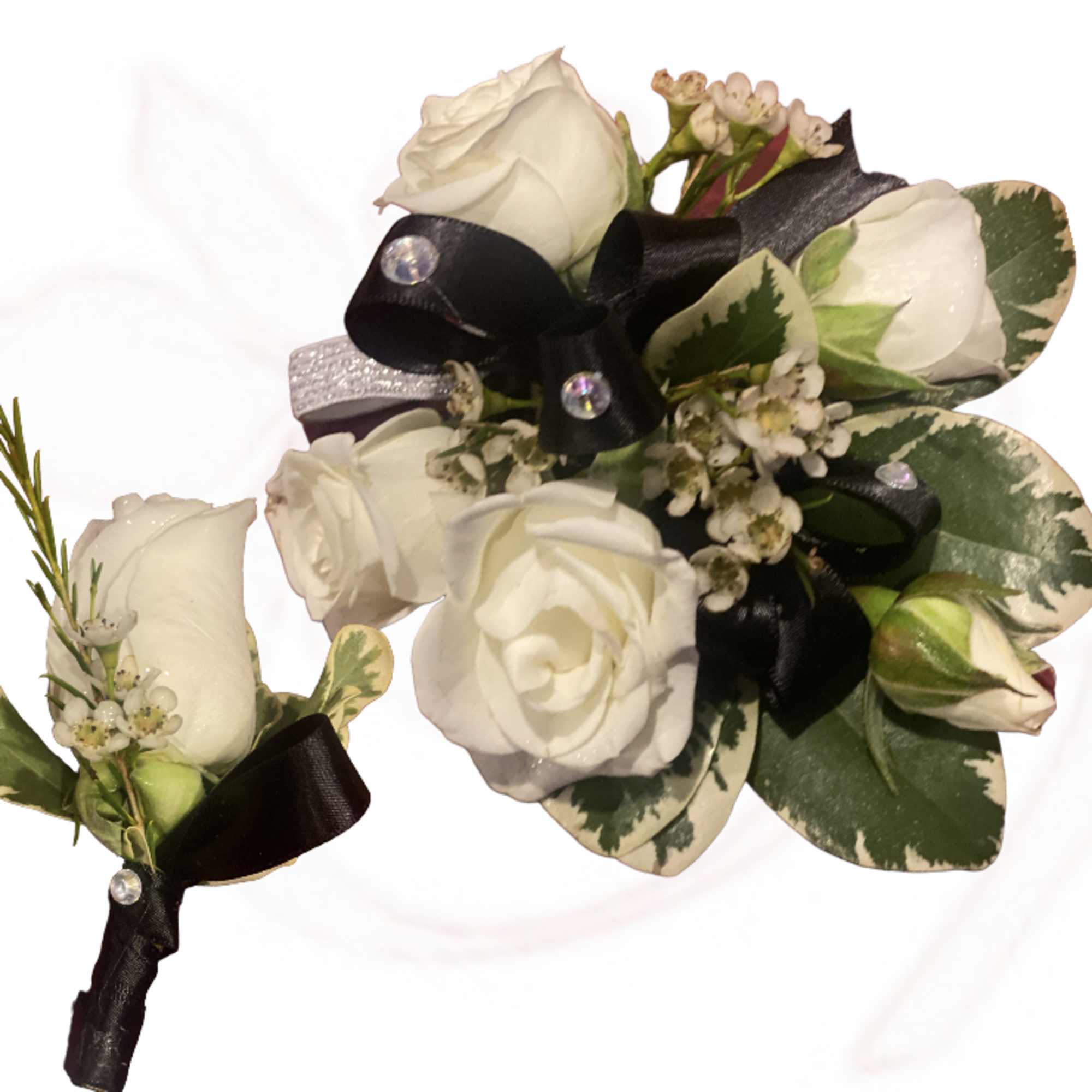 White rose boutonniere with black ribbon and variegated leaves