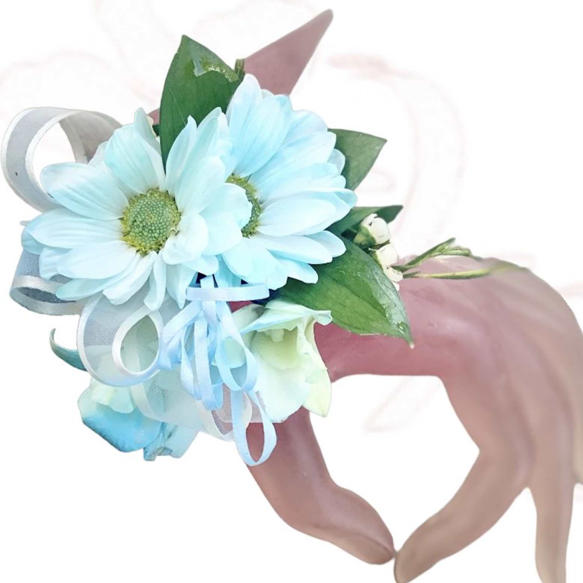 Blue daisy corsage with ribbon on a wrist