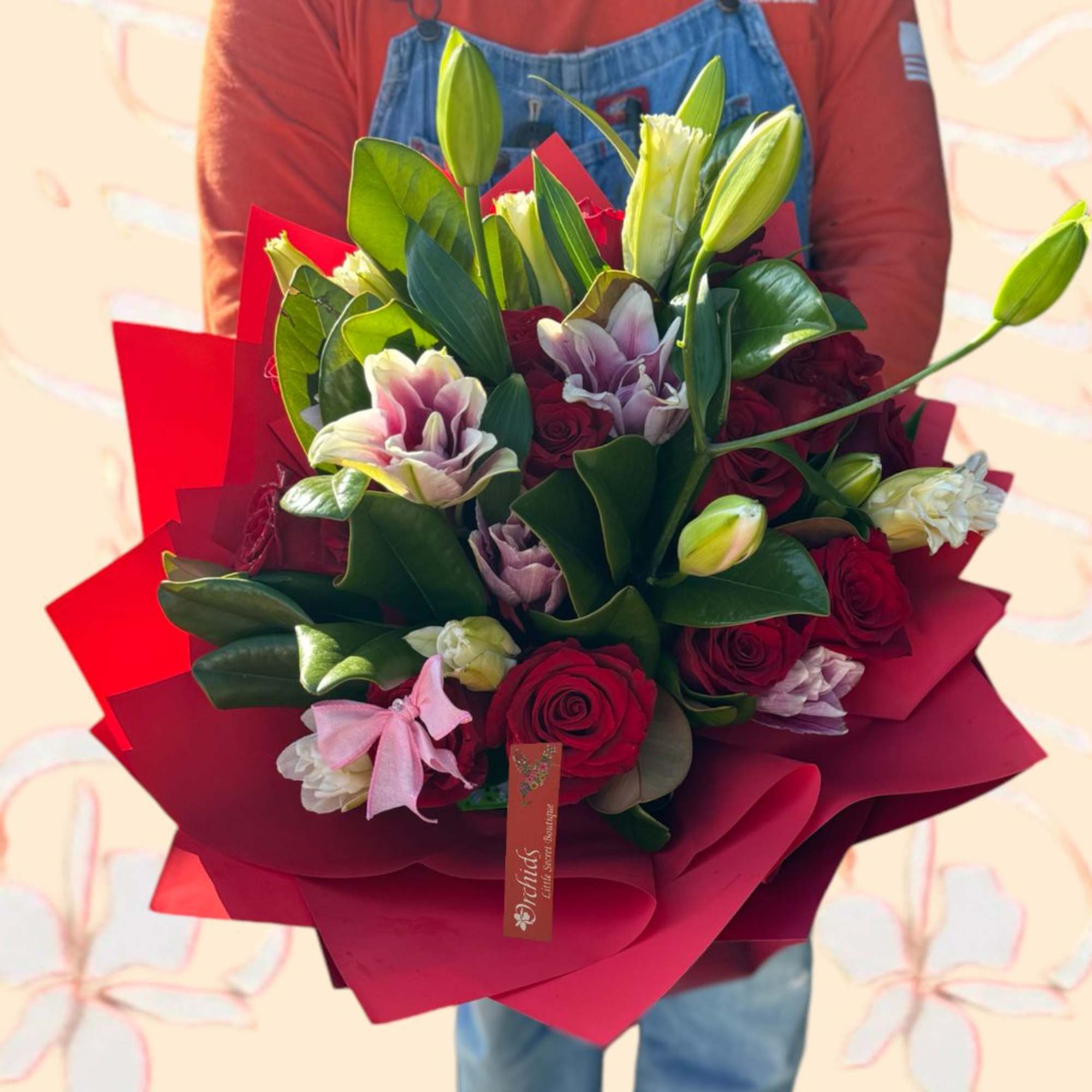Make your recipient stargaze with this stunning stargazer and red roses hand
