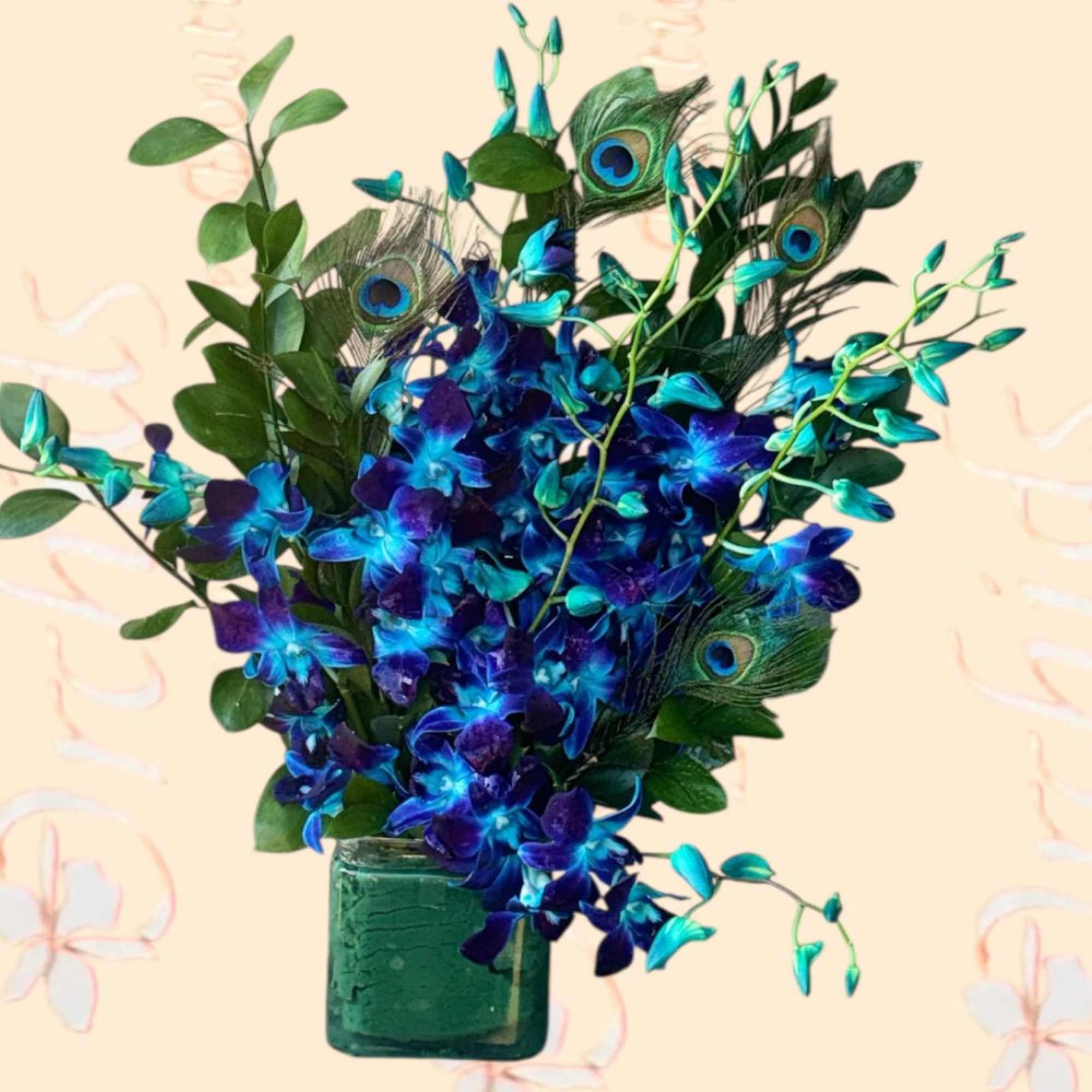 Blue orchids and peacock feathers in a green glass vase