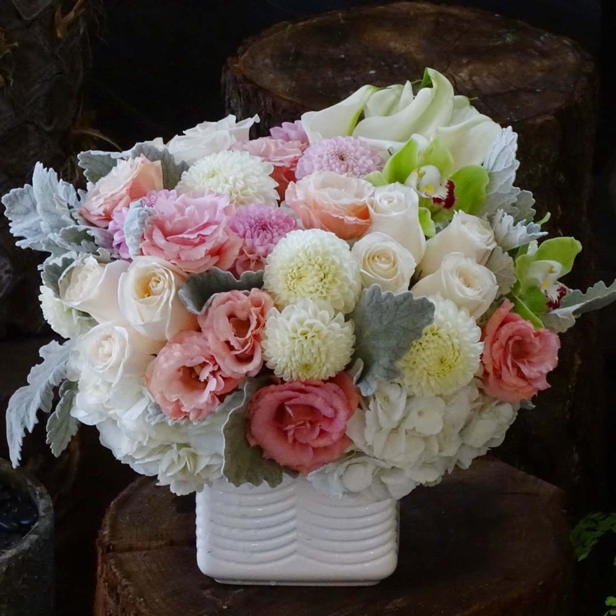 Pink and white bouquet in a white vase