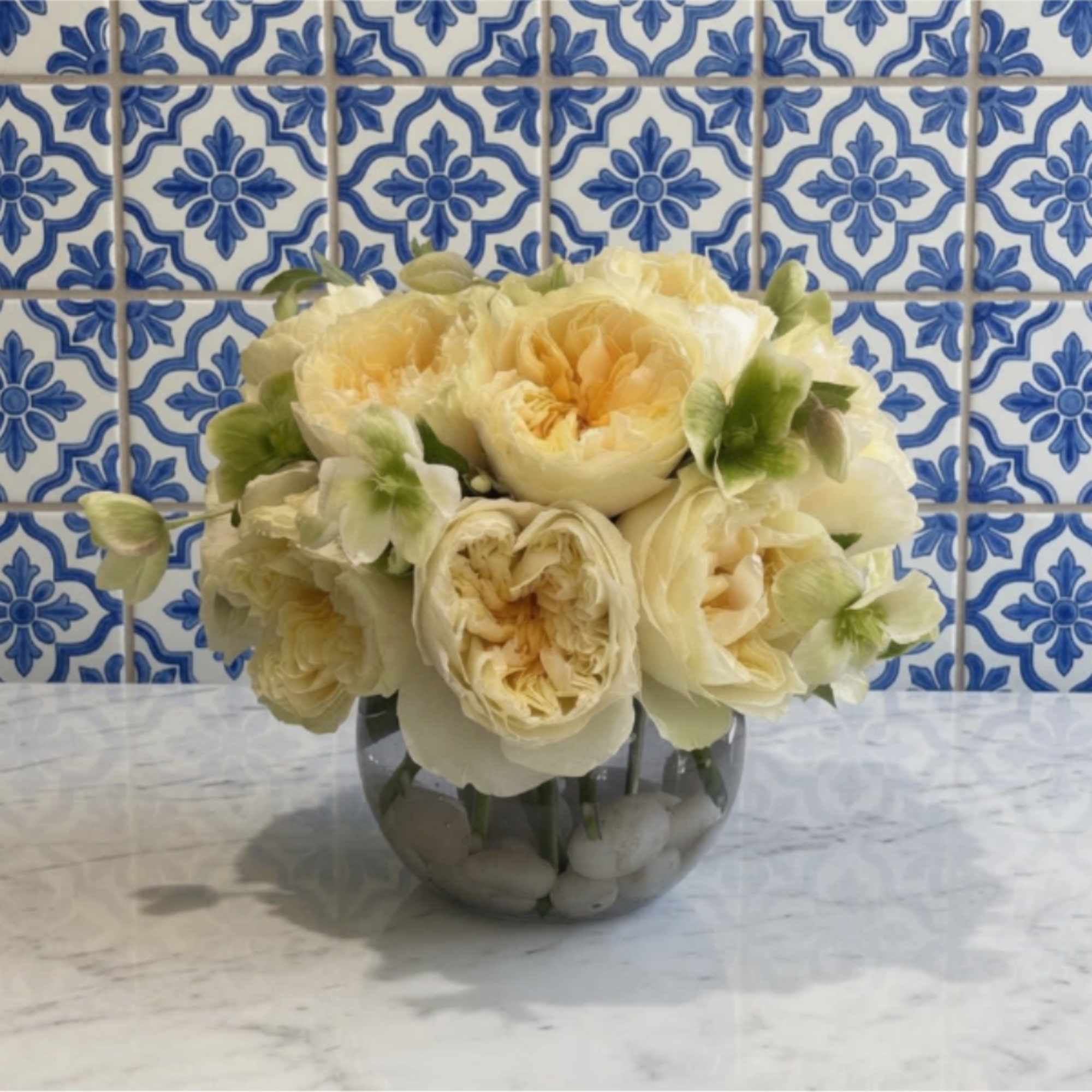 This arrangement is the definition of understated luxury. Featuring creamy ivory garden, photo 2 of 2