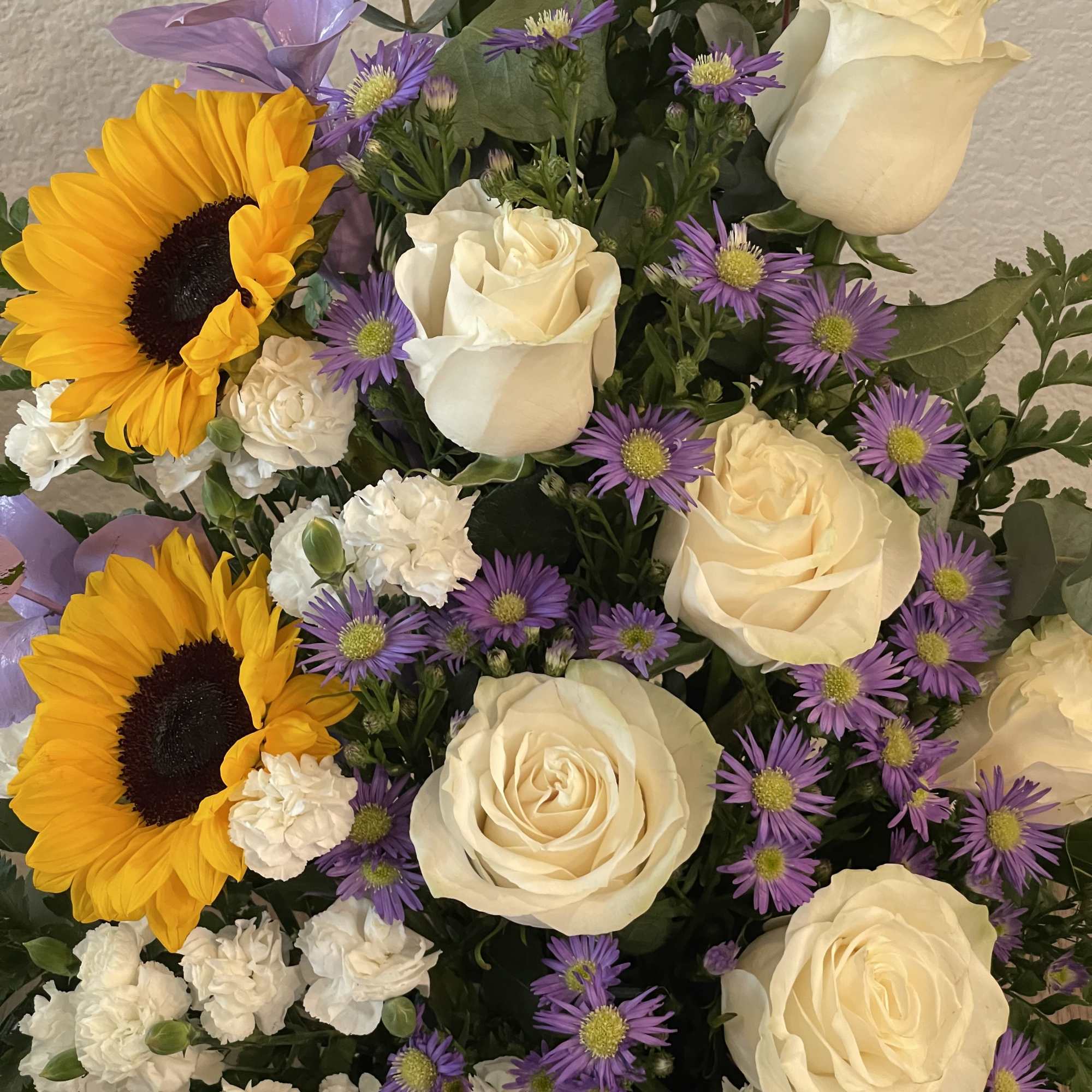 Cream-white roses paired with bold yellow sunflowers create a cheerful birthday bouquet, photo 2 of 2