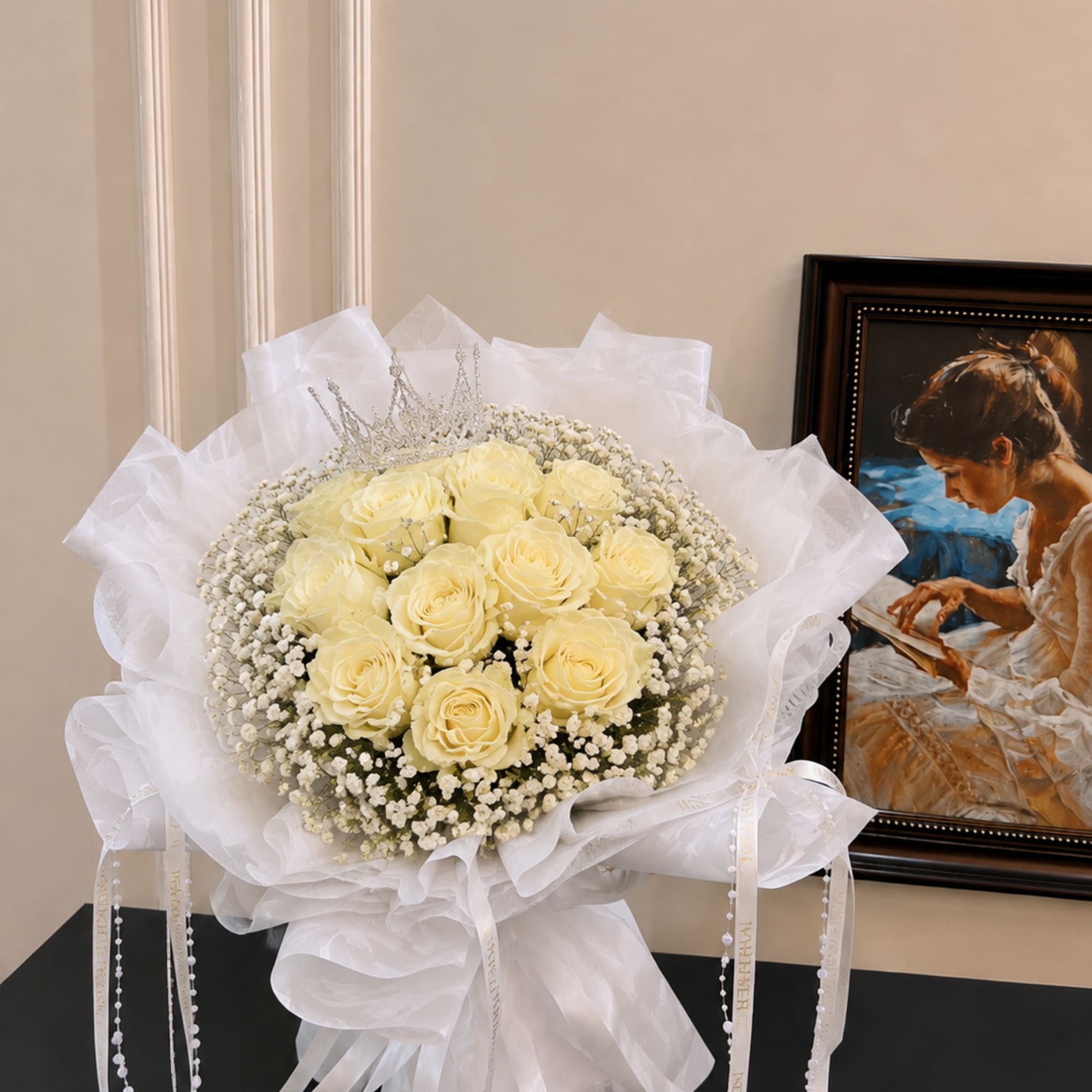 Bouquet of pale yellow roses with a silver tiara and white wrapping